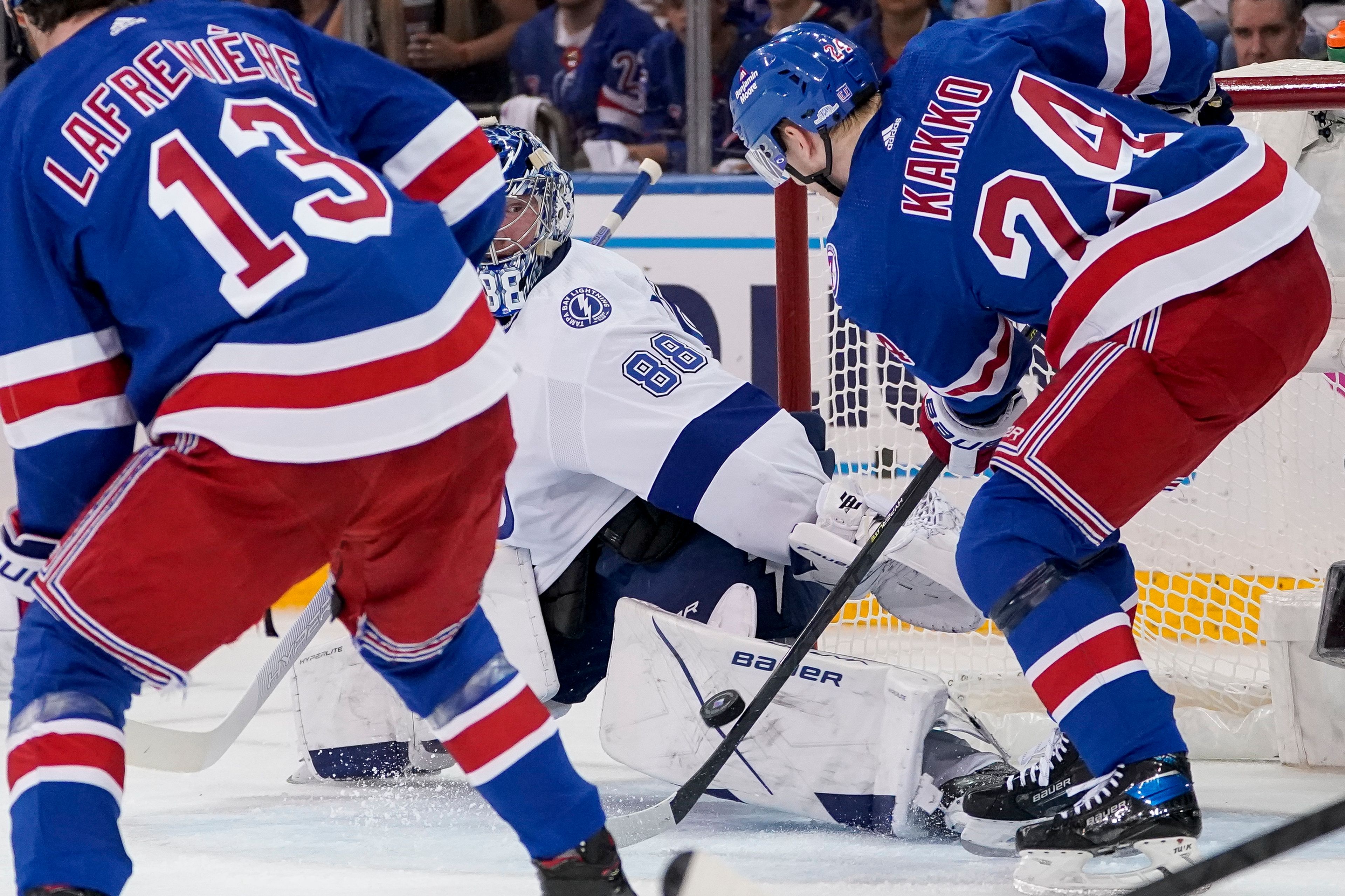 New York Rangers right wing Kaapo Kakko (24) scores on Tampa Bay Lightning goaltender Andrei Vasilevskiy (88) in the first period of Game 2 of the NHL hockey Stanley Cup playoffs Eastern Conference finals, Friday, June 3, 2022, in New York. (AP Photo/John Minchillo)