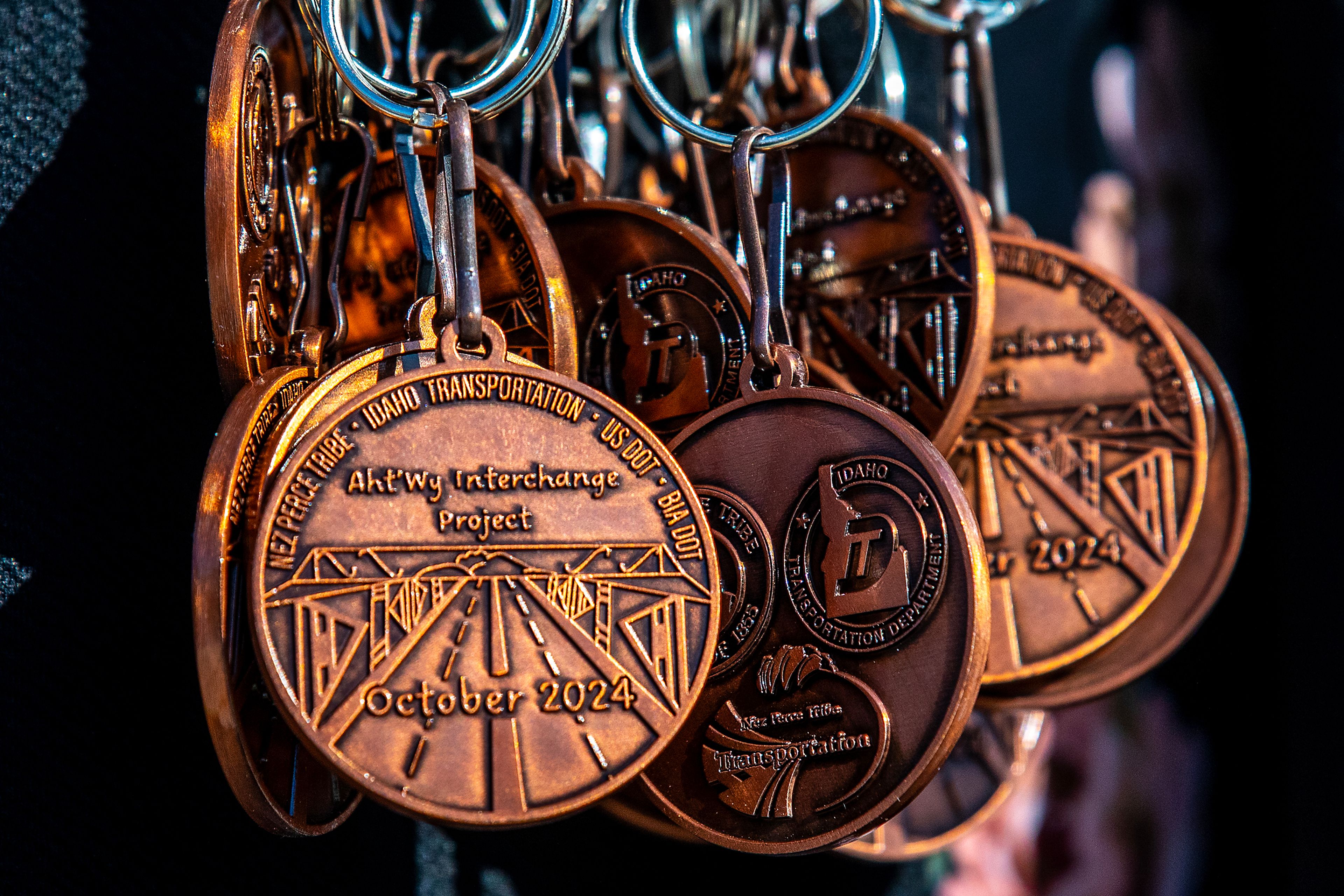 Medals are given to groups that played a role in the Aht�Wy Interchange at the ribbon cutting ceremony Thursday over U.S. Highway 95/12 in Lewiston.