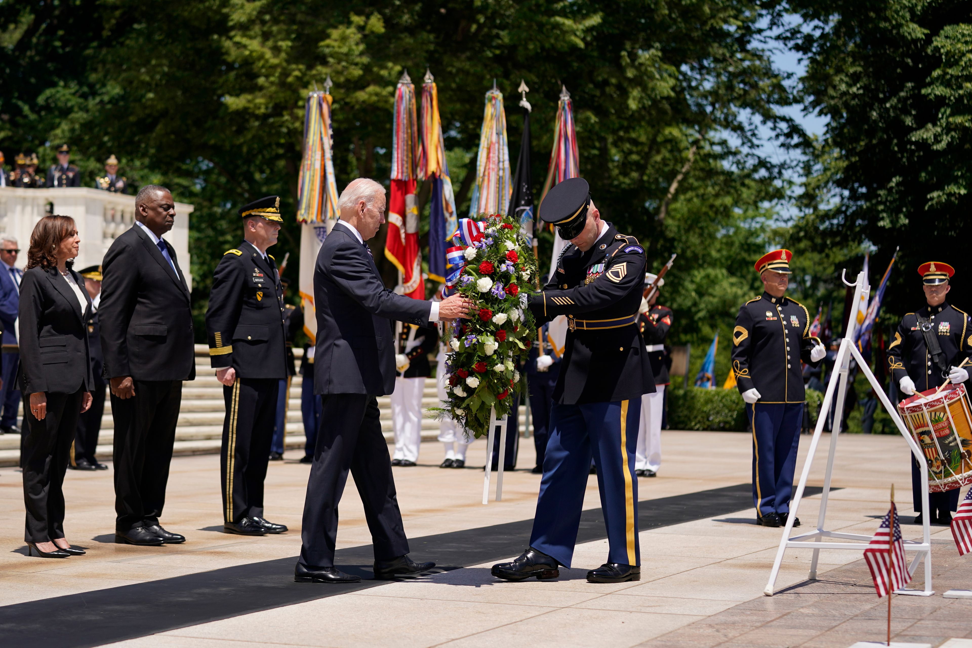 President Joe Biden lays a wreath at The Tomb of the Unknown Soldier at Arlington National Cemetery on Memorial Day, Monday, May 30, 2022, in Arlington, Va. Vice President Kamala Harris, left, and Defense Secretary Lloyd Austin, second from left, watch. (AP Photo/Andrew Harnik)