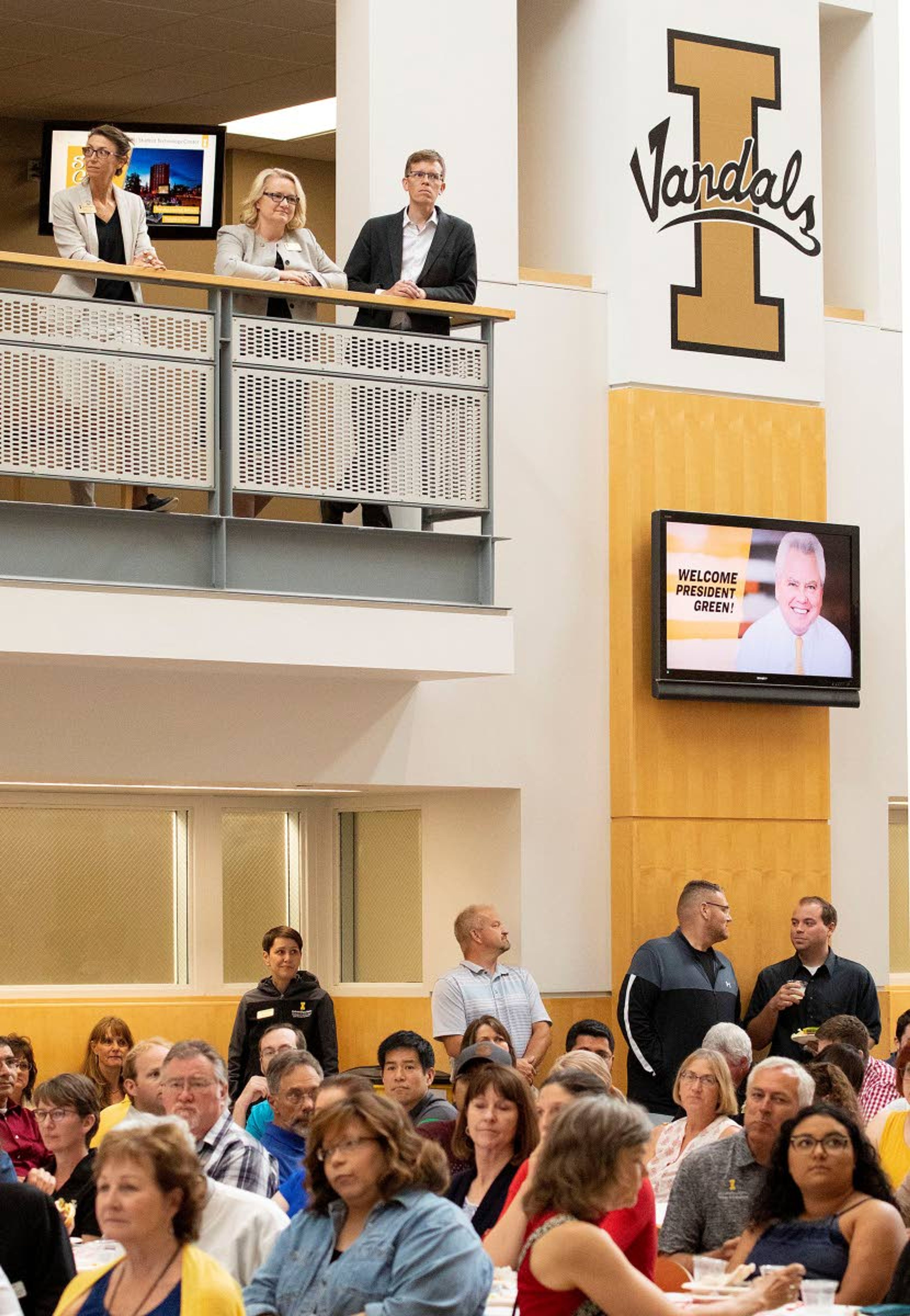 Faculty, staff and students listen while University of Idaho President Scott Green speaks during a welcome barbecue July 2 at the Idaho Commons in Moscow.