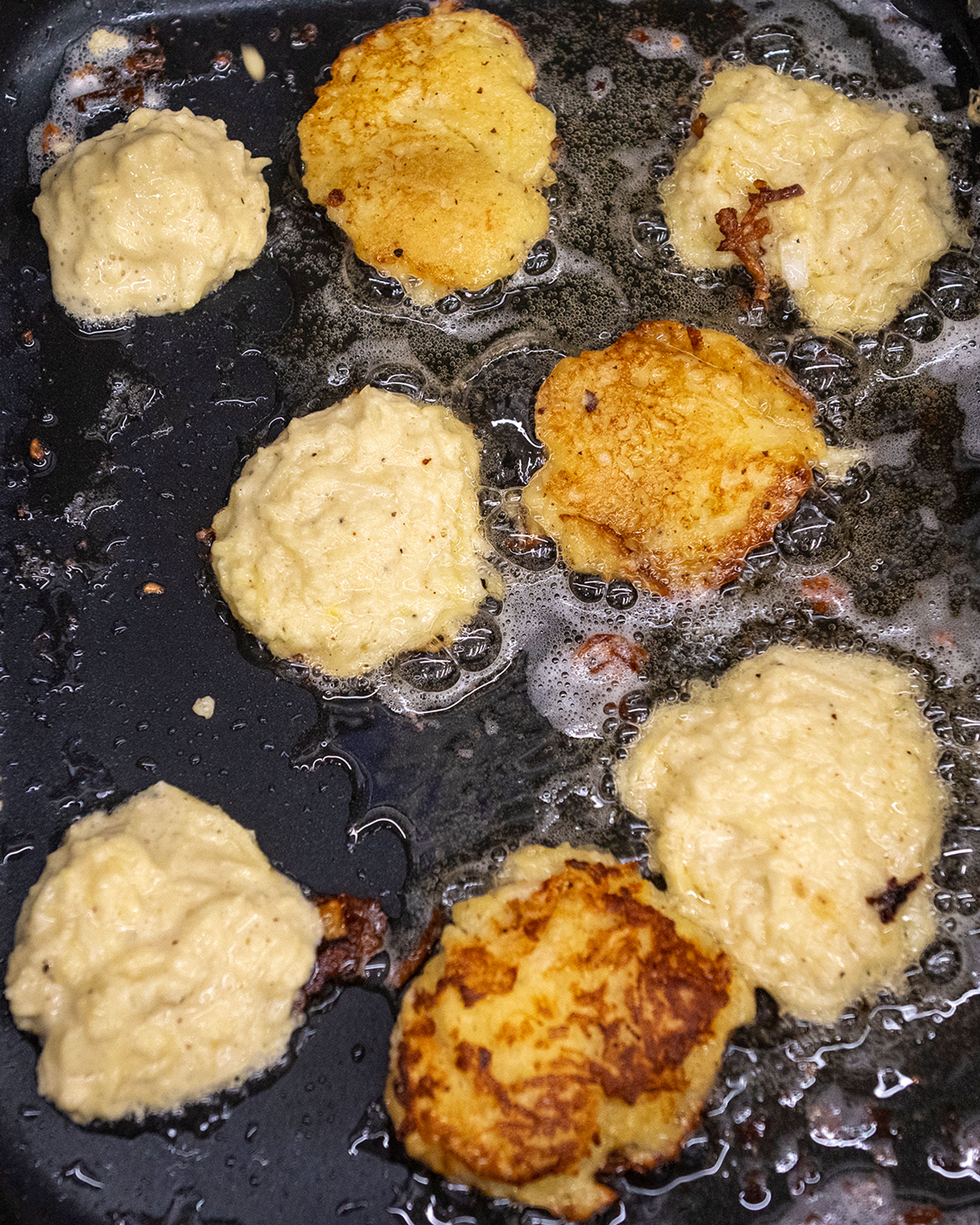 Cecilia Hellman cooks kartoffelpuffers, which are German potato pancakes, Friday at Pullman High School’s multicultural night.