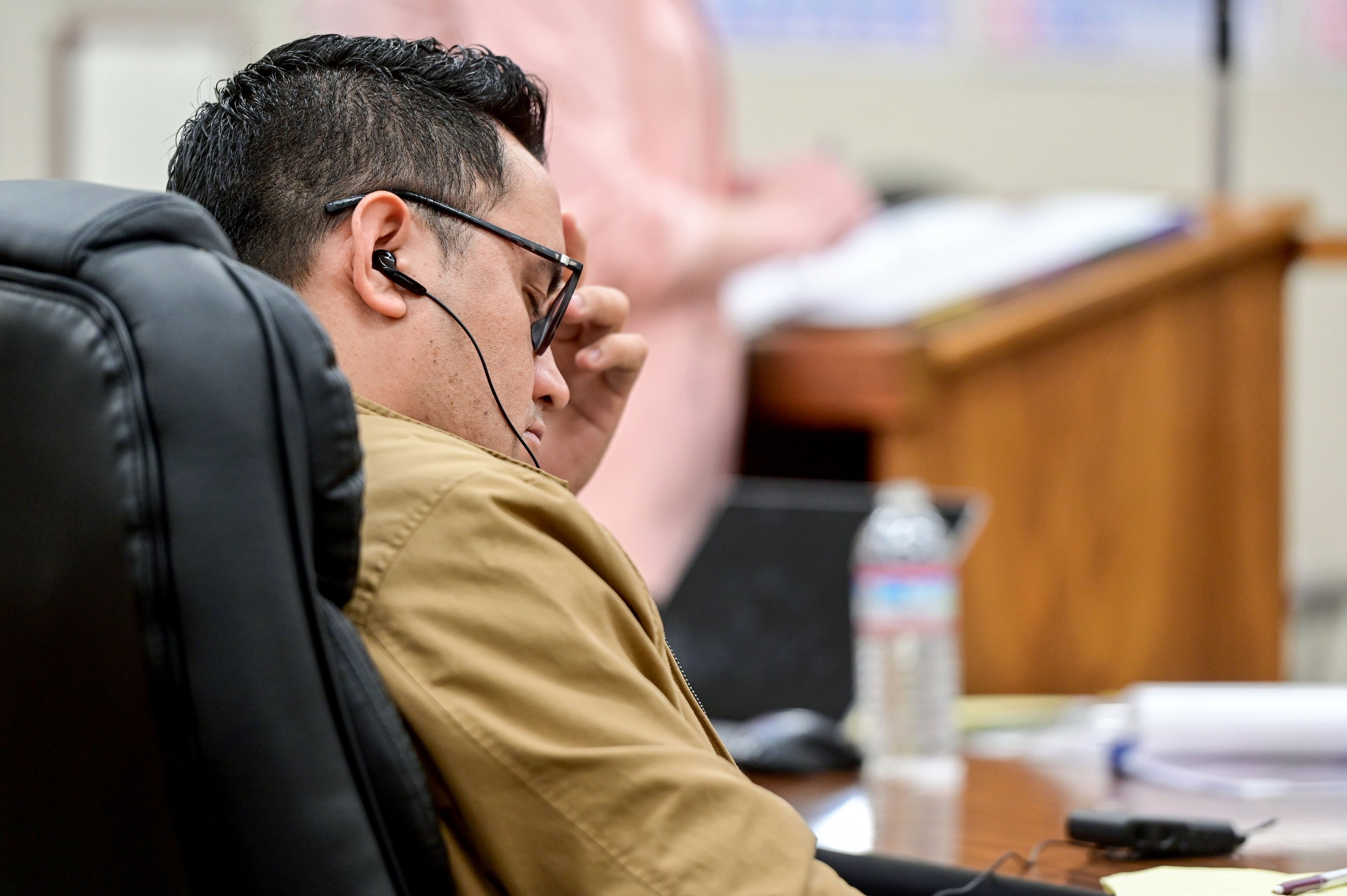 Juan Trejo Perez rubs his forehead while listening to a live translation of a witness examination in a Whitman County Superior Court room in Colfax on Tuesday. A jury will choose whether to convict the 34-year-old Trejo Perez of felony third-degree child molestation.