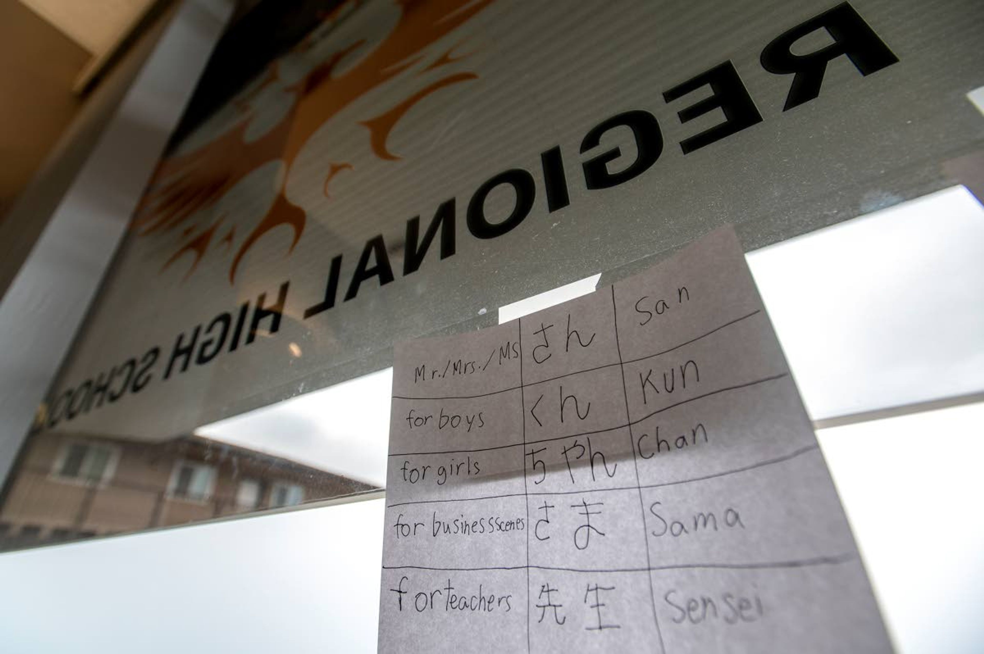 Japanese cheat sheets are taped to the window of Paradise Creek Regional High School in Moscow.