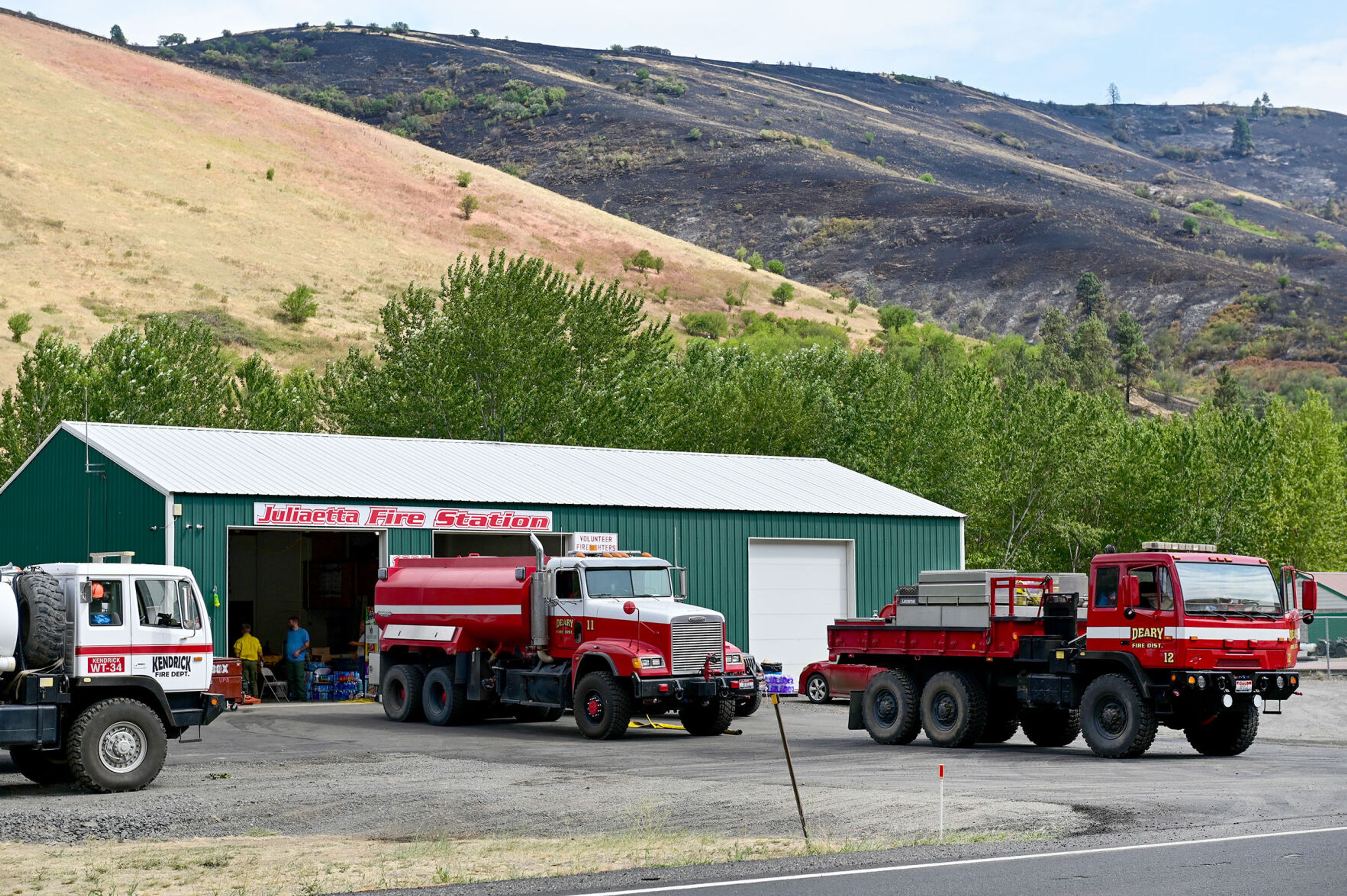 Fire trucks from nearby Deary and Kendrick fire departments park at the Juliaetta Fire Station on Monday.