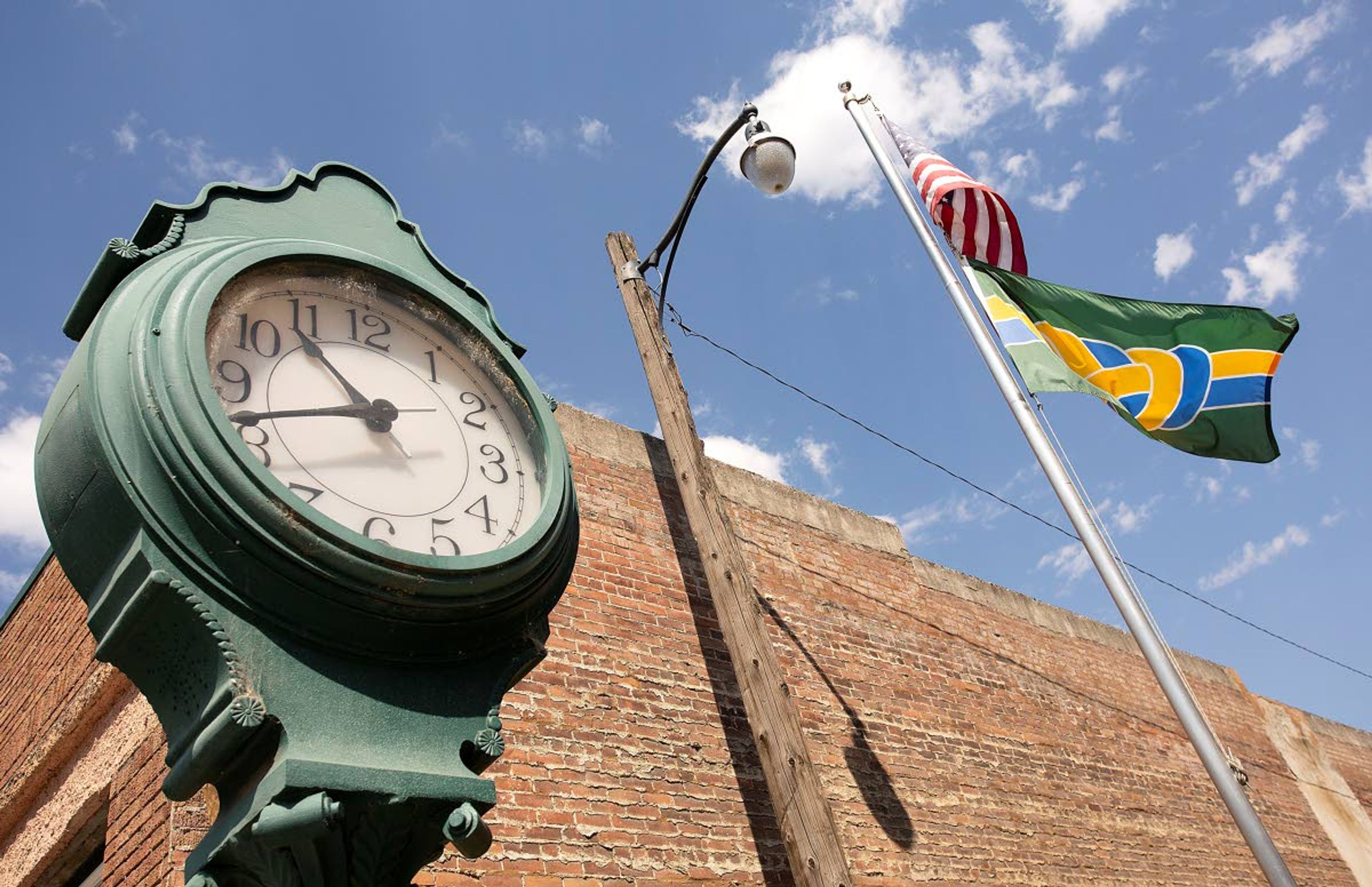 The Palouse city flag flies below the United State flag on Thursday outside city hall in Palouse. The flag was designed by local Palouse resident Moses Boone and adopted in 2019.