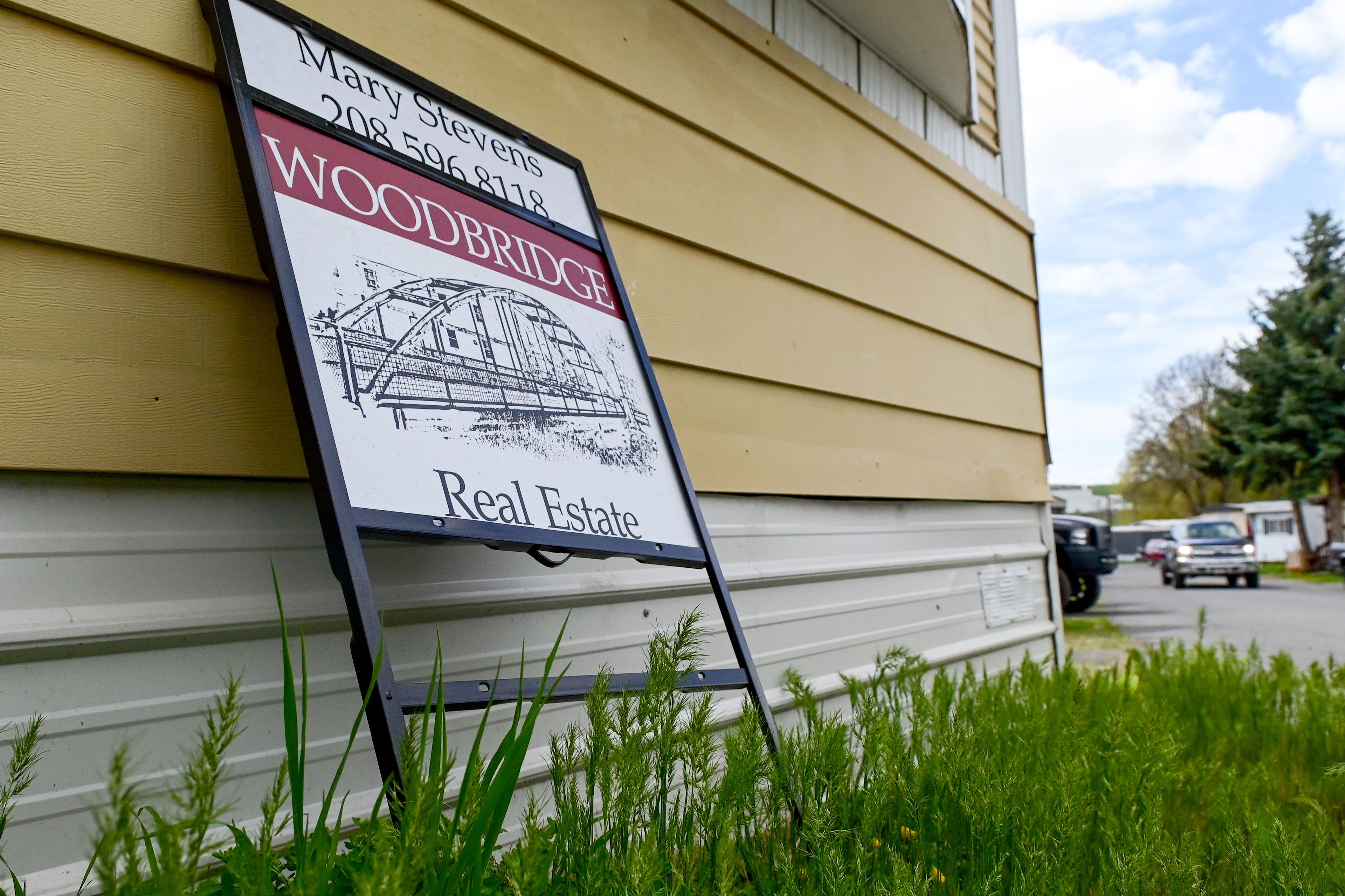 A real estate sign leans against a home at the Abiel Mobile Home Community in Moscow on Thursday. Residents say they are facing rising rent increases at the mobile home park.