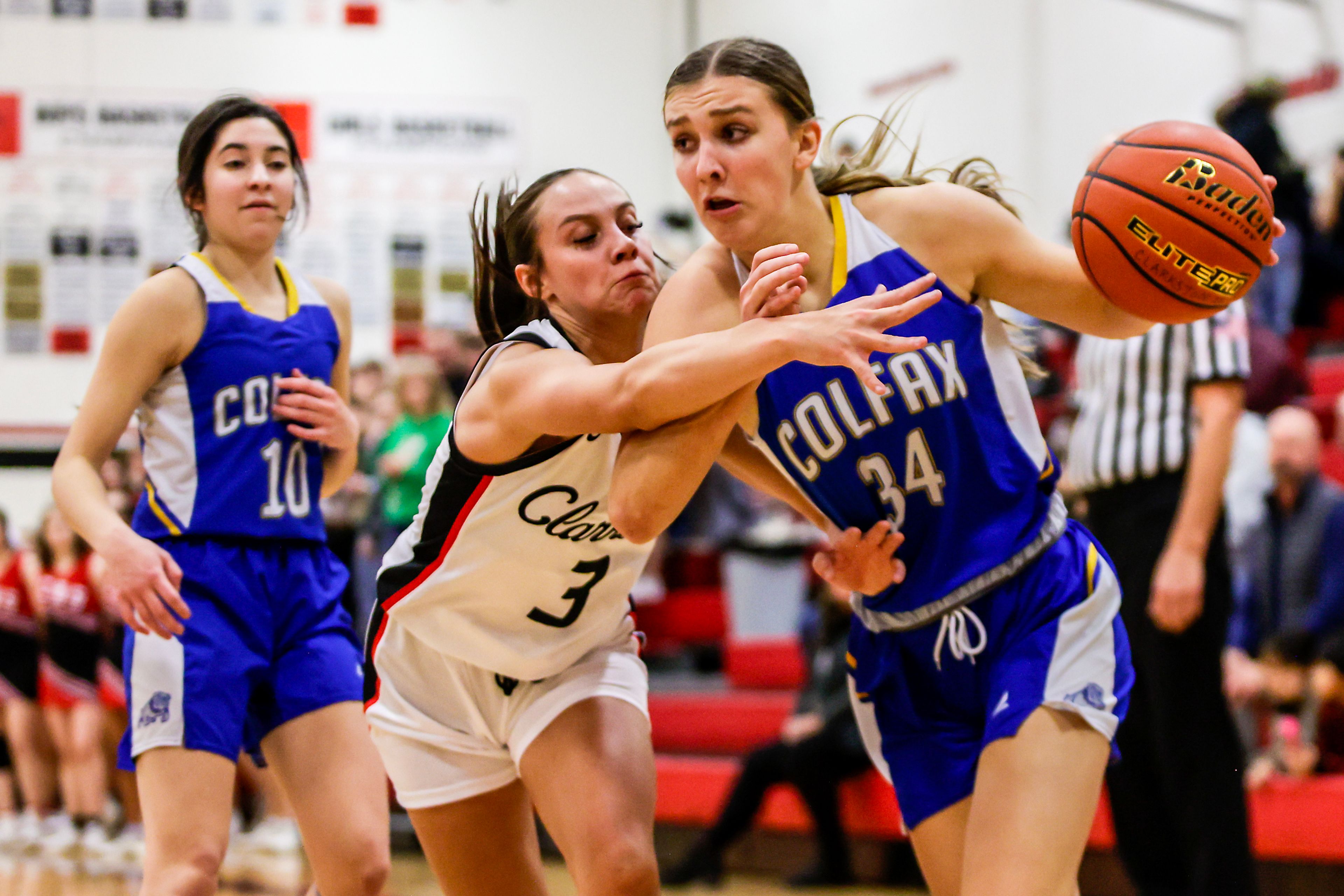 Colfax post Ava Swan runs towards the basket as Clarkston guard Kendall Wallace guards her in a quarter of a nonleague game Thursday at Clarkston.