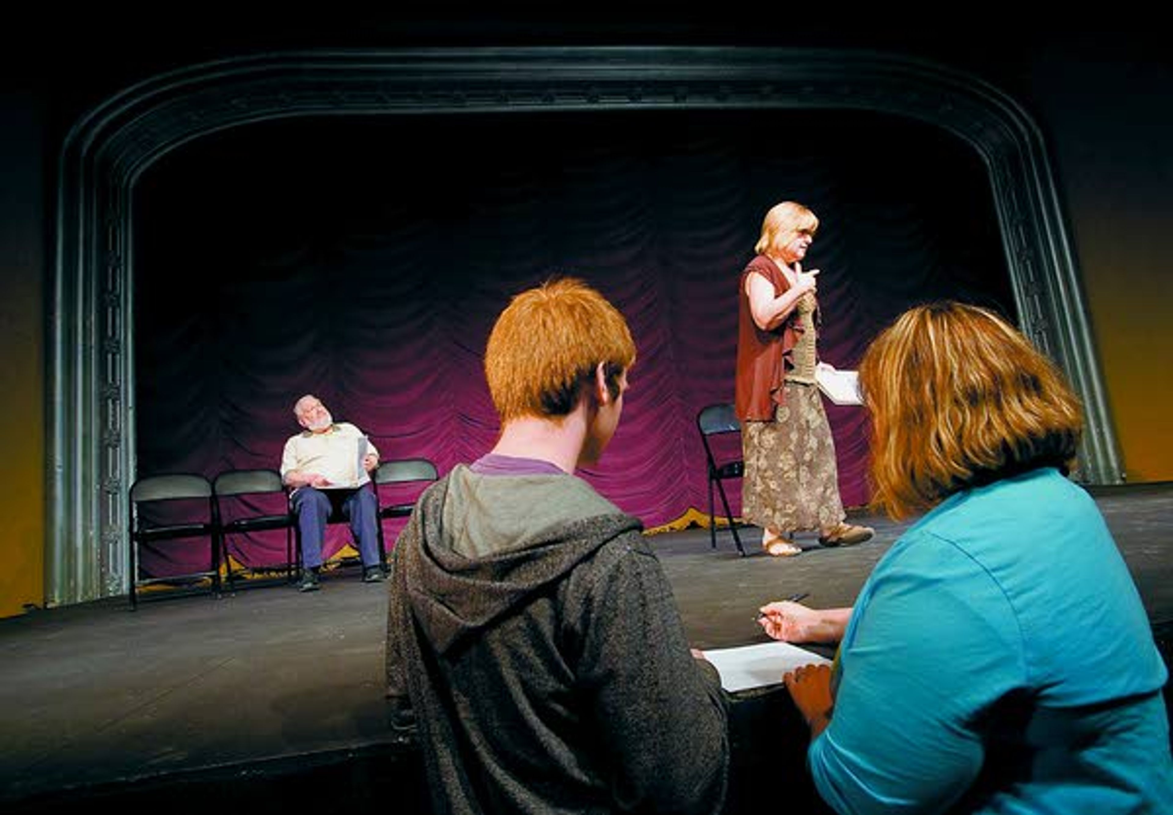 Paradise Creek Regional High School student Robert Knight (front left) talks with English teacher Cyndi Faircloth (front right) about his short play, while actors Roger Wallins (left) and Cathy Brinkerhoff rehearse it Friday at the Kenworthy Performing Arts Centre in Moscow.