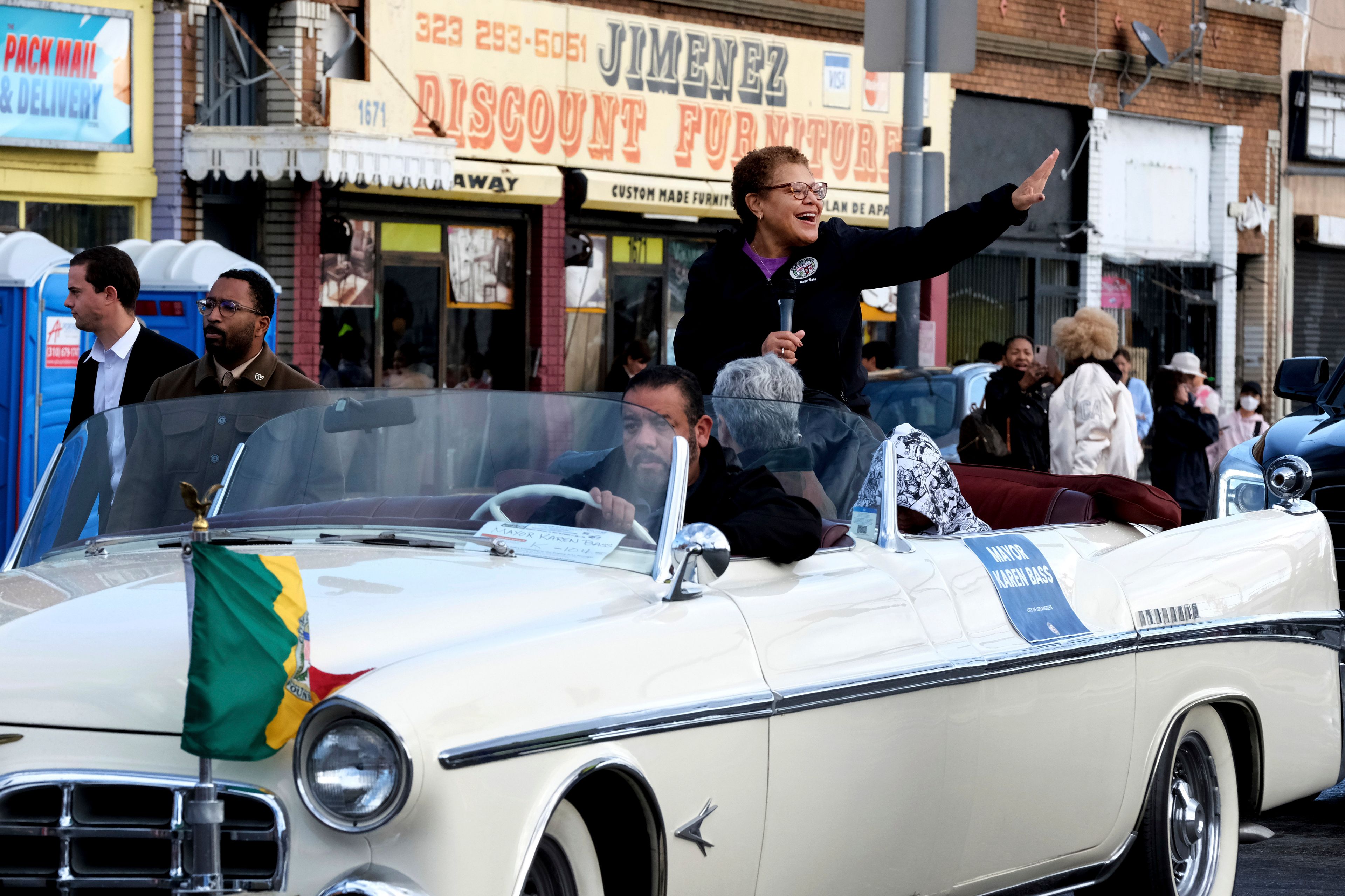 Newly elected Los Angeles Mayor Karen Bass waves as she rides along during the Kingdom Day Parade in Los Angeles, Monday, Jan. 16, 2023. After a two-year hiatus because of the COVID-19 pandemic, the parade, America's largest Martin Luther King Day celebration returned. (AP Photo/Richard Vogel)