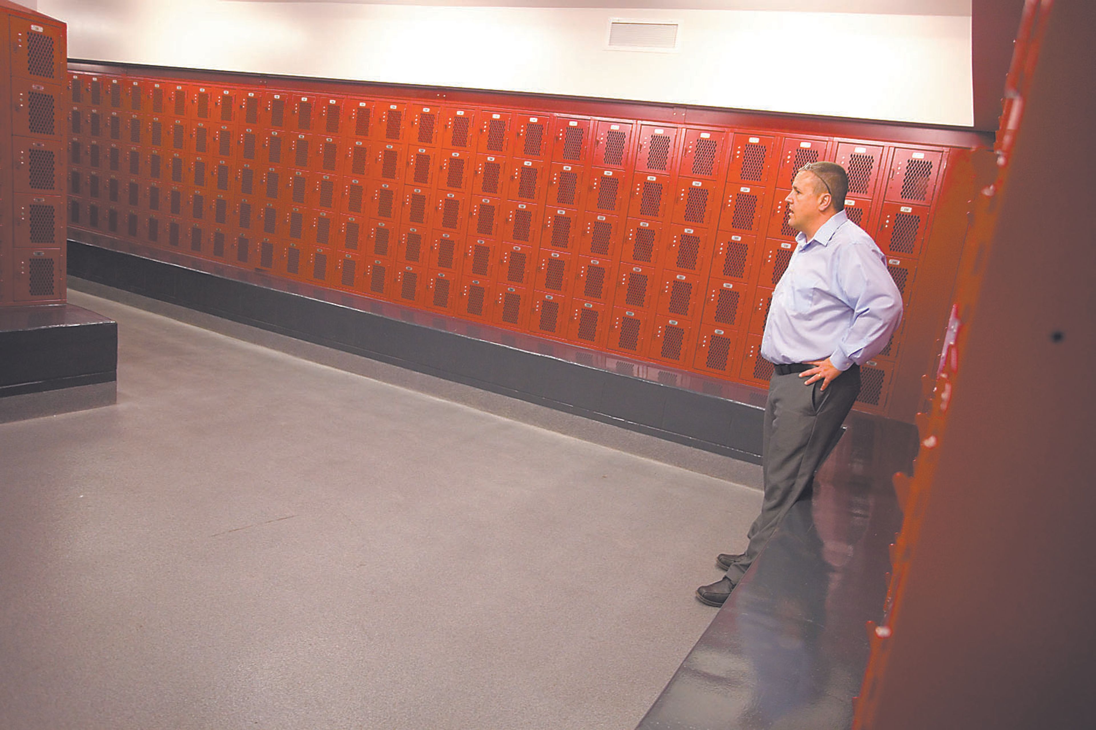 Moscow Middle School Principal Kevin Hill talks  Friday about one of the new locker rooms that will be used by students in physical education classes. Construction on Moscow schools is complete except for some minor items found in a tour of the work this week.