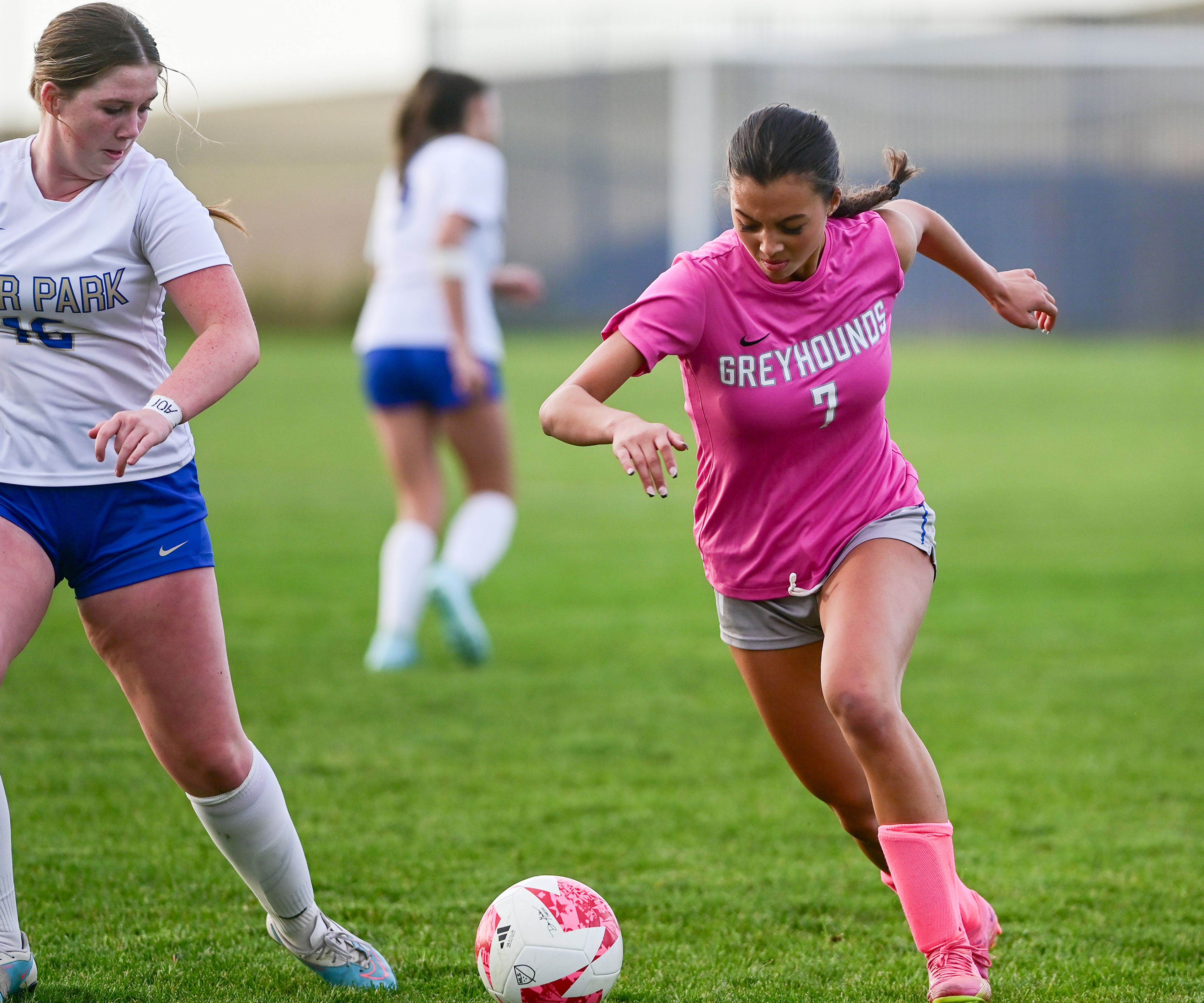 Pullman junior Sidney Johnson dribbles past Deer Park senior Kaylee Reiter during a match Thursday in Pullman.