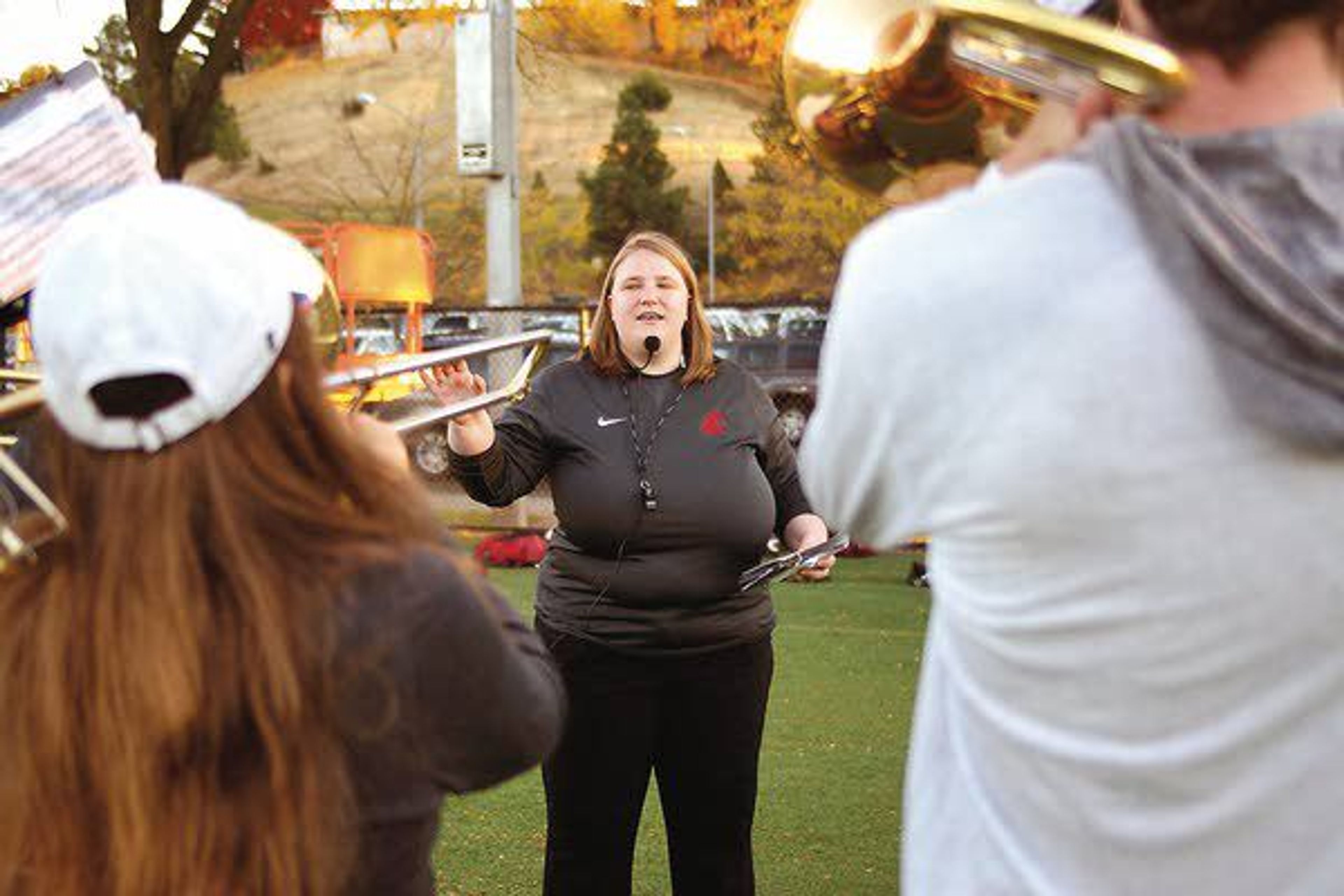 Washington State University Marching Band assistant director Sarah Miller works with band members during rehearsal Oct. 24.