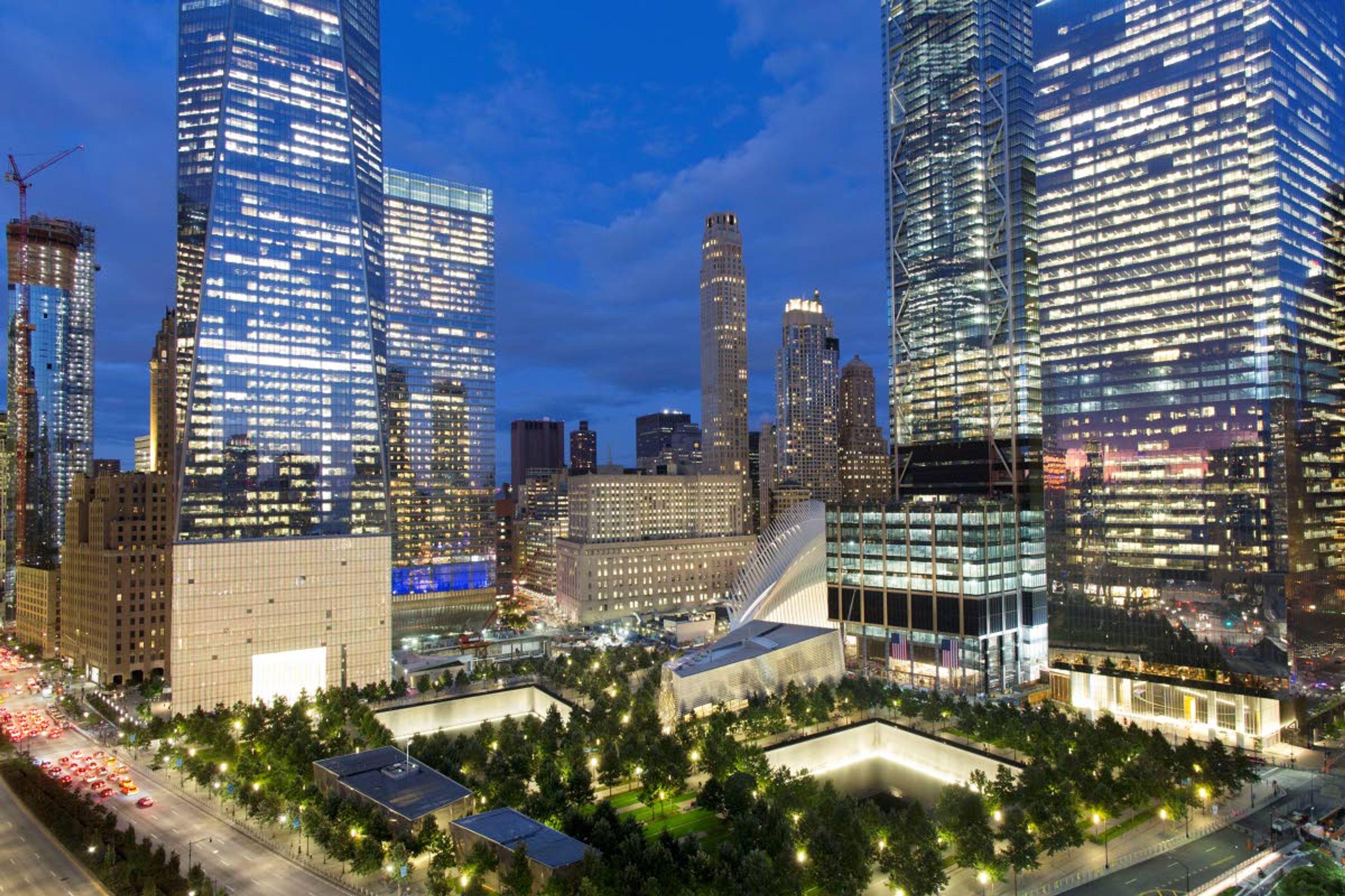 FILE - The National September 11 Memorial and Museum, bottom, is surrounded by high-rise towers on Sept. 8, 2017, in New York. Museum officials have objected and sought changes to "The Outsider," a documentary being released this week that reveals disputes that went into development of the Sept. 11 memorial and museum, which opened in 2014. (AP Photo/Mark Lennihan, File)