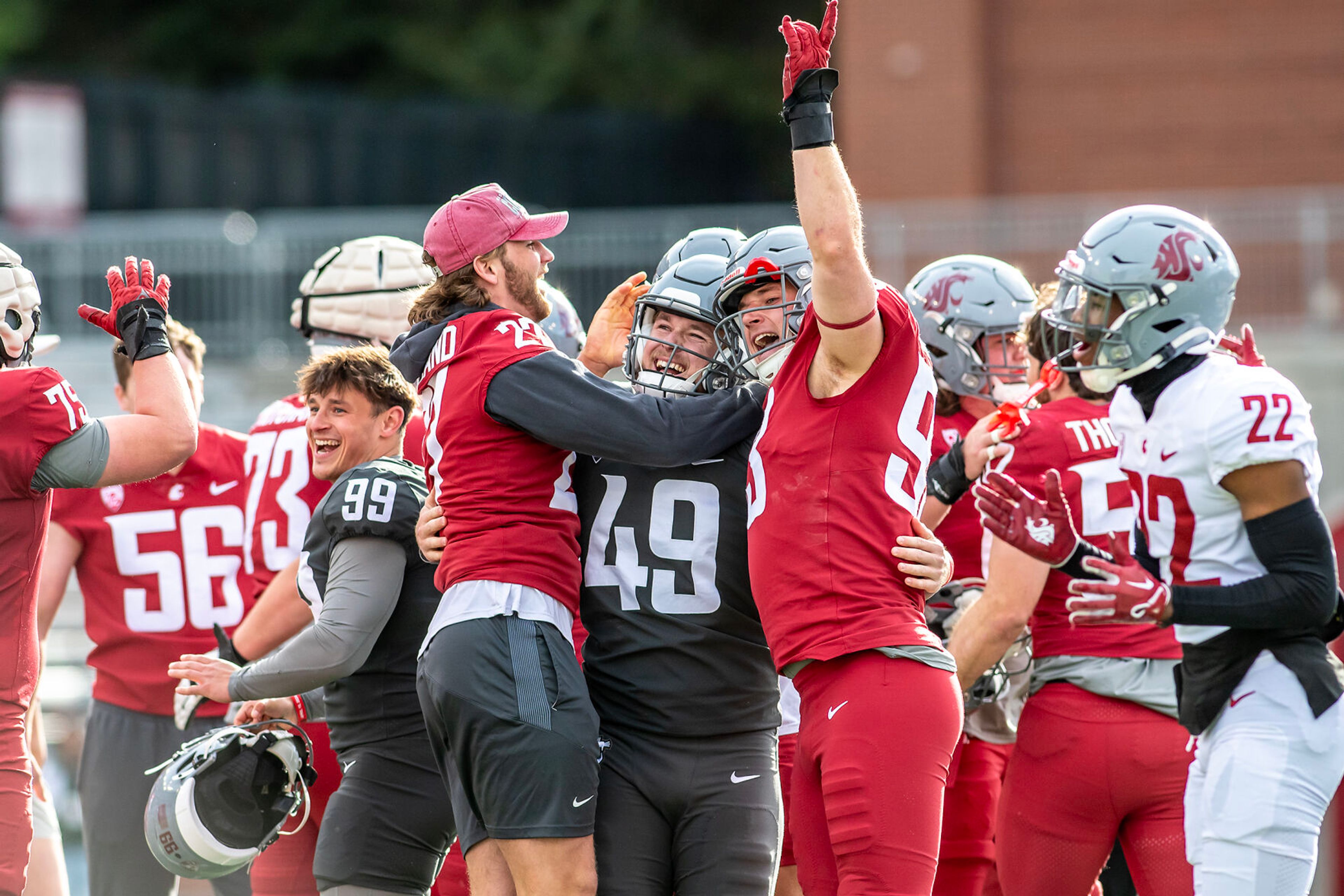 Players celebrate a field goal by kicker Dean Janikowski to end the Crimson and Gray Game at Washington State University in Pullman.