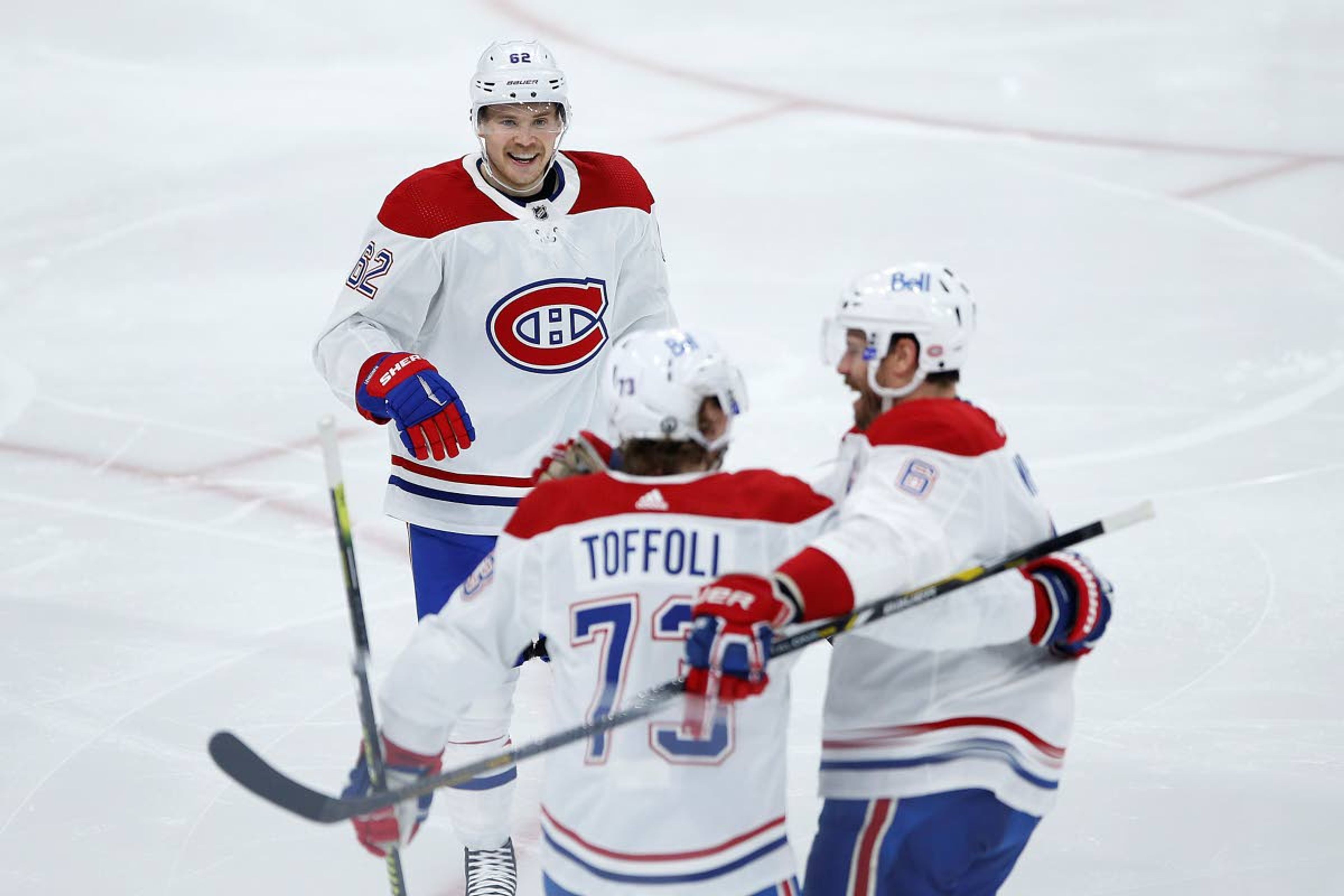 Montreal Canadiens' Artturi Lehkonen (62) and Shea Weber (6) celebrate Tyler Toffoli's (73) goal against the Winnipeg Jets during the second period of Game 2 of an NHL hockey Stanley Cup second-round playoff series Friday, June 4, 2021, in Winnipeg, Manitoba. (John Woods/The Canadian Press via AP)