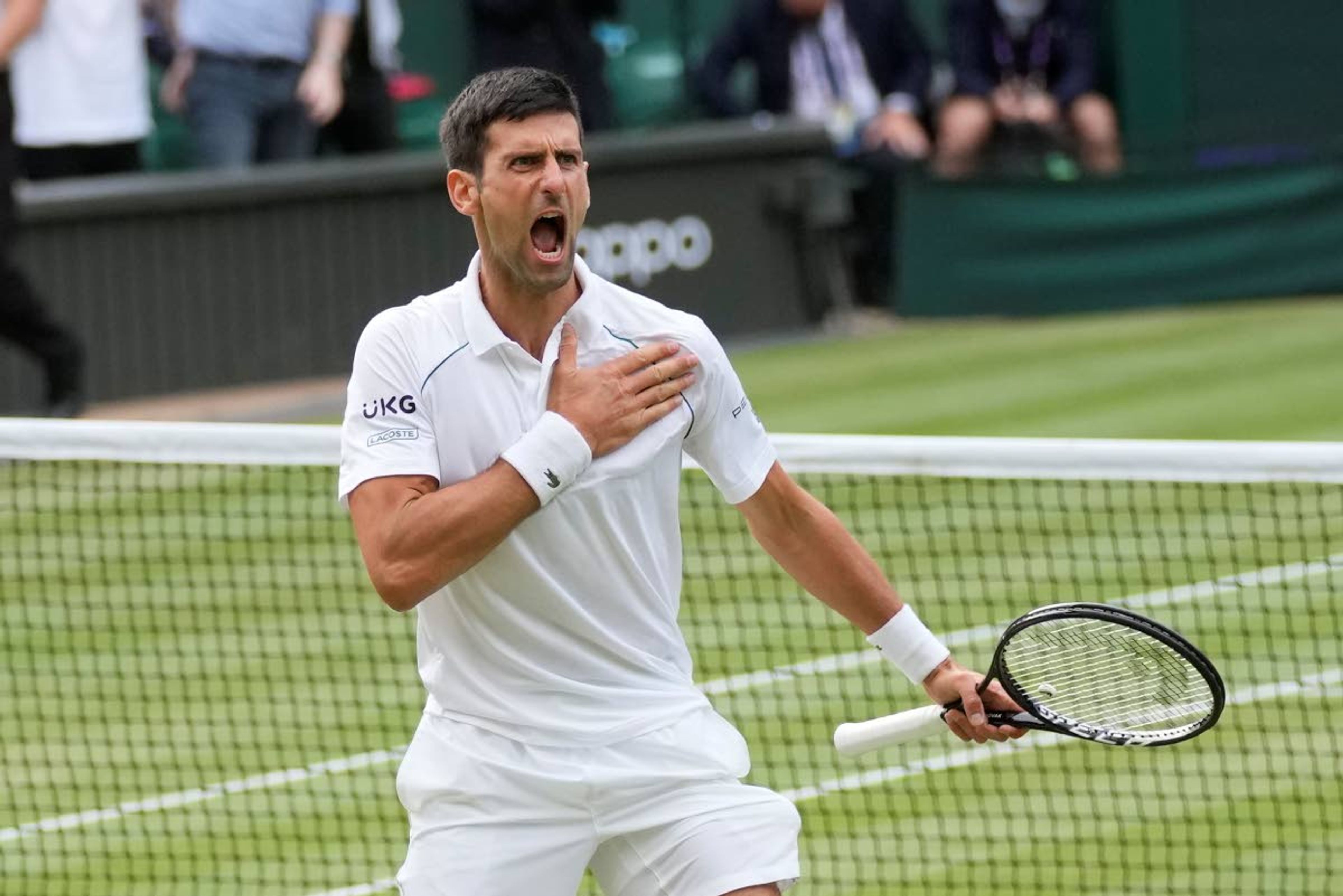 Associated PressSerbia’s Novak Djokovic celebrates after defeating Canada’s Denis Shapovalov during the men’s singles semifinals match on Day 11 of the Wimbledon Tennis Championships Friday in London.