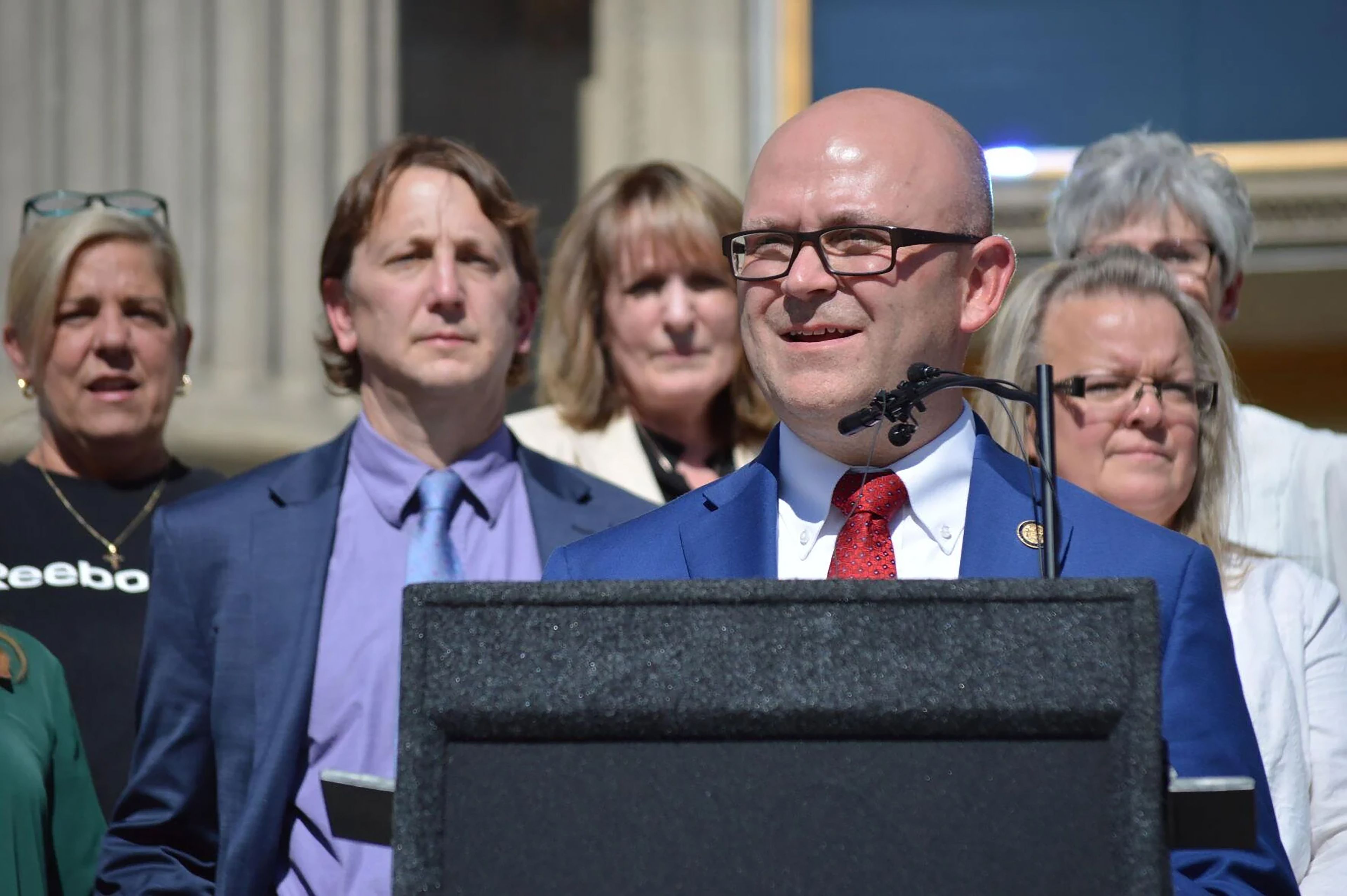 Idaho Secretary of State Phil McGrane and county clerks from around the state gather on the Capitol steps Wednesday to talk about election security and accessibility in Idaho before the Nov. 5 general election. 