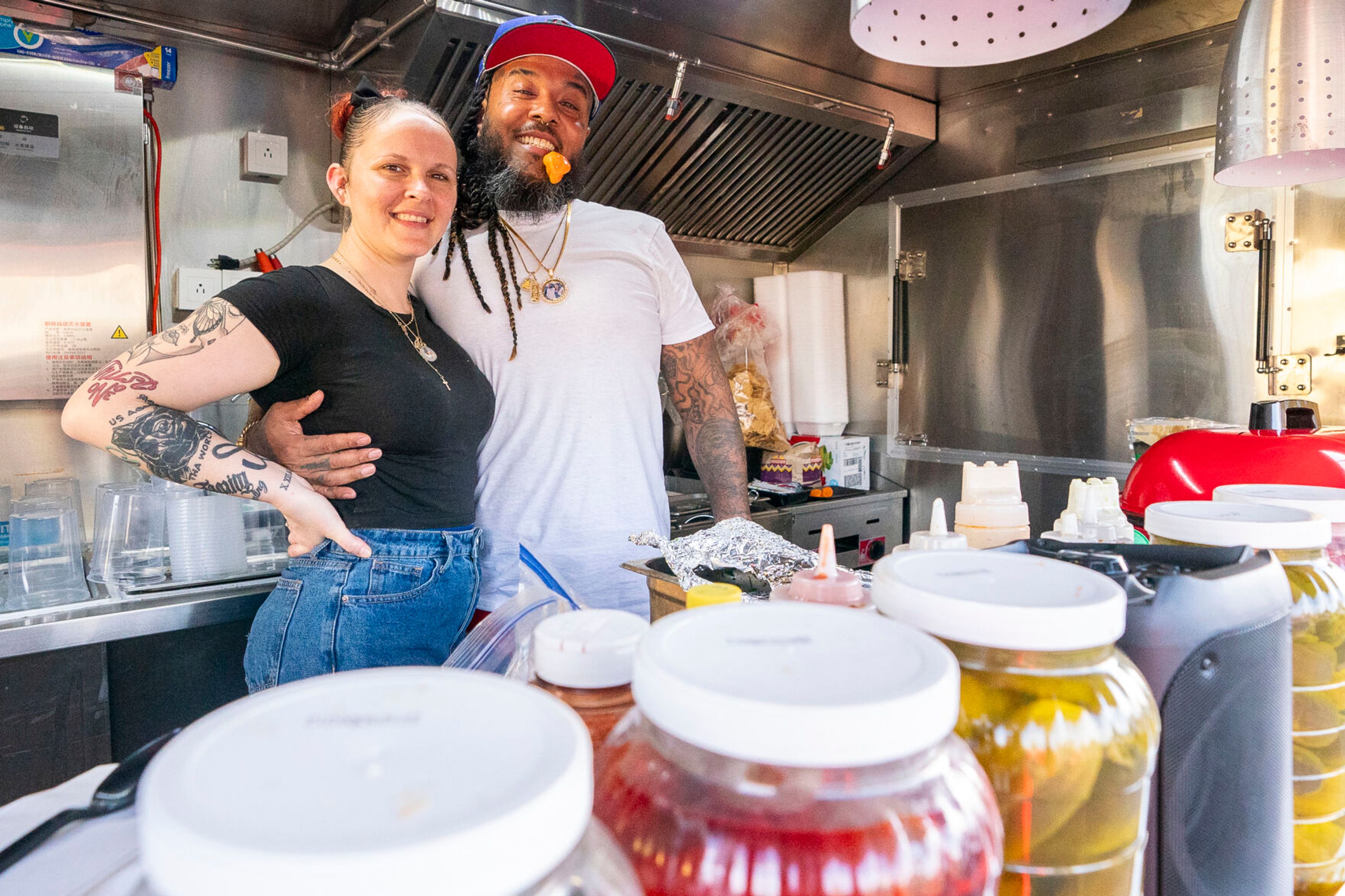 Chili Blues owners Shamar ‘Chili’ Jackson, right, poses for a portrait with his fiancé Reana Buoy inside the food truck on Tuesday located off of 14th Avenue in Lewiston.