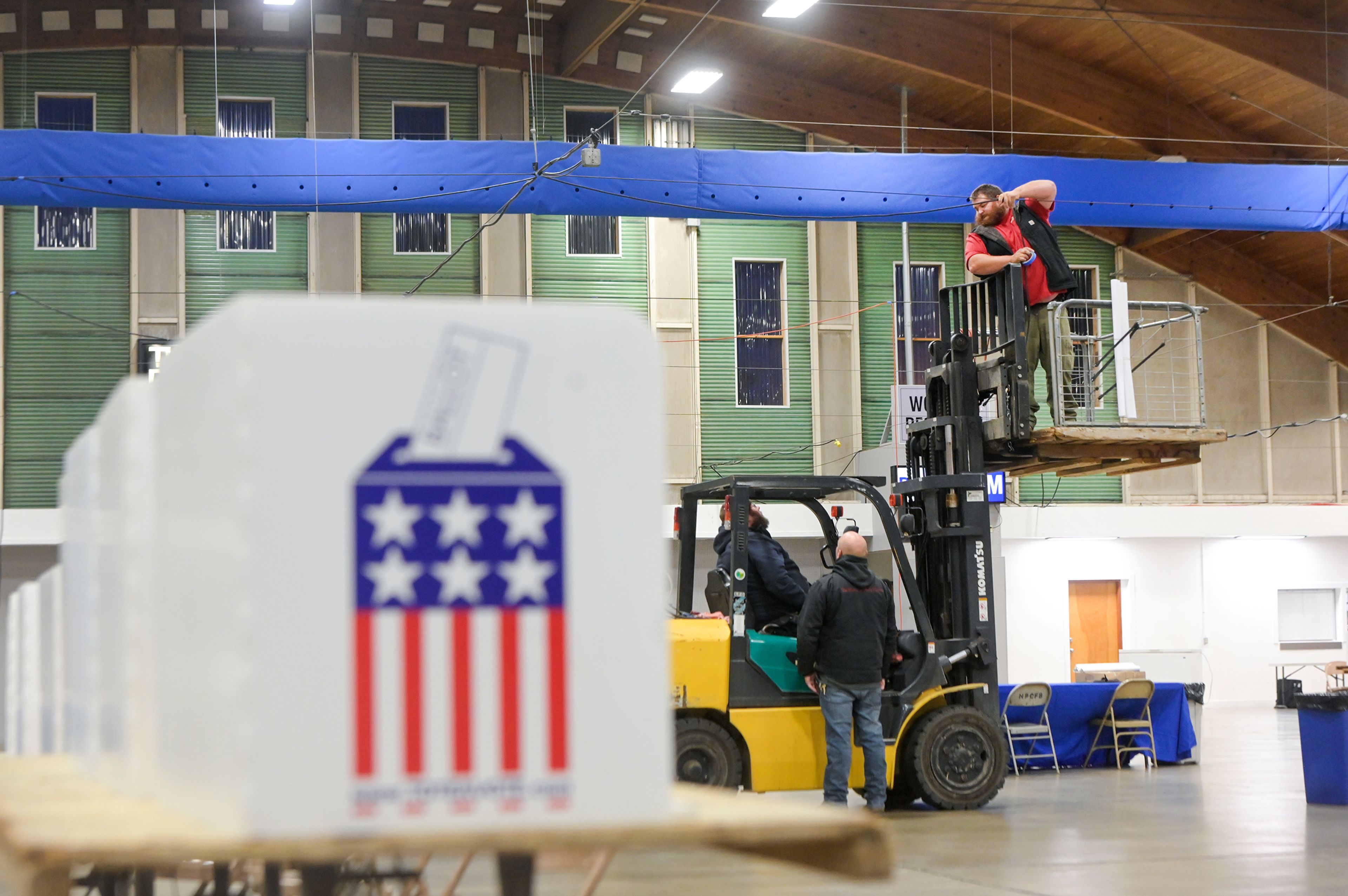 Nez Perce County maintenance crew members extension cords Monday in preparation for Election Day at the Nez Perce County Fairgrounds in Lewiston.