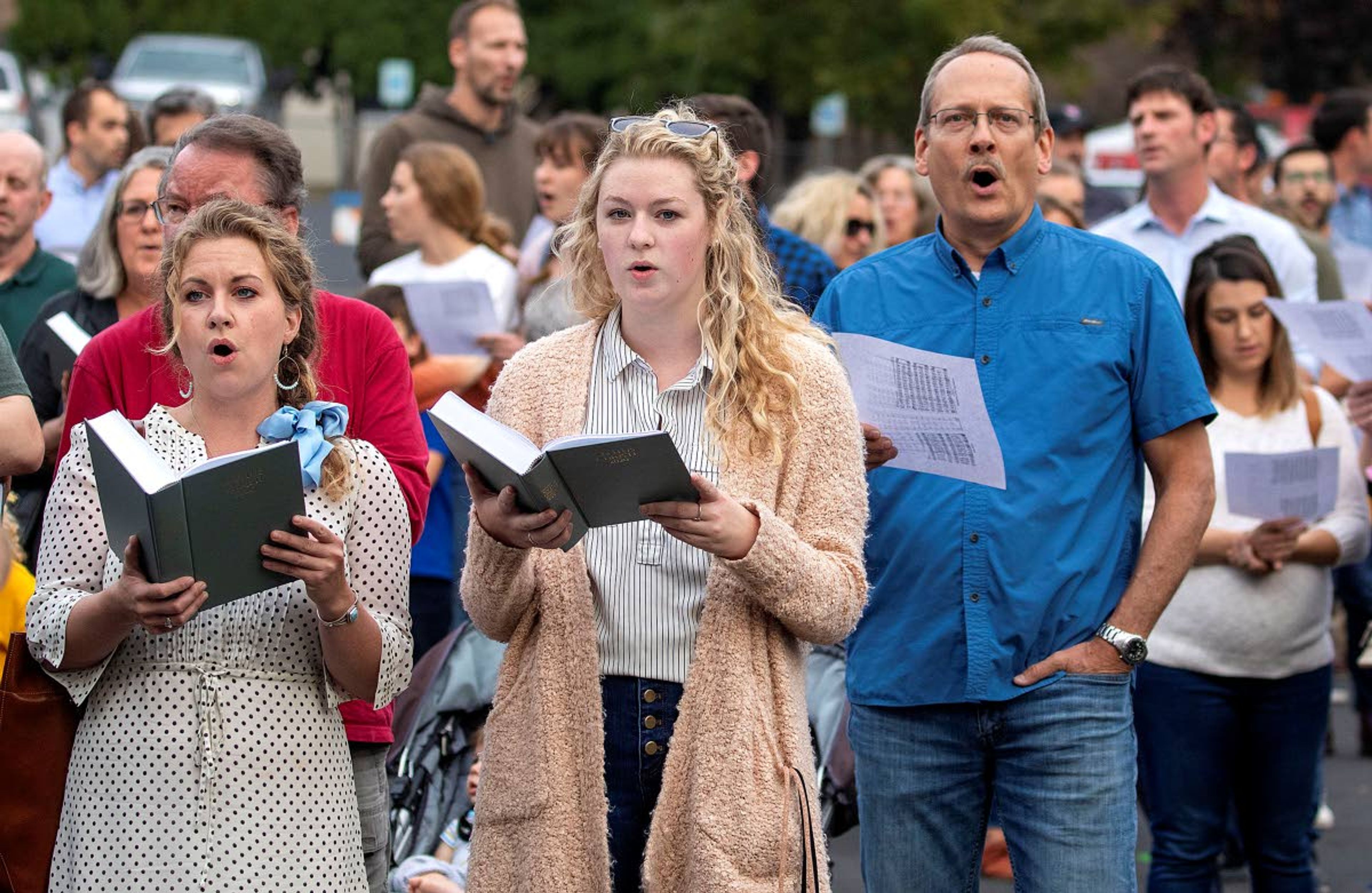 Christ Church members and guests sing during a "flash psalm sing" organized by the church on Wednesday outside Moscow City Hall.