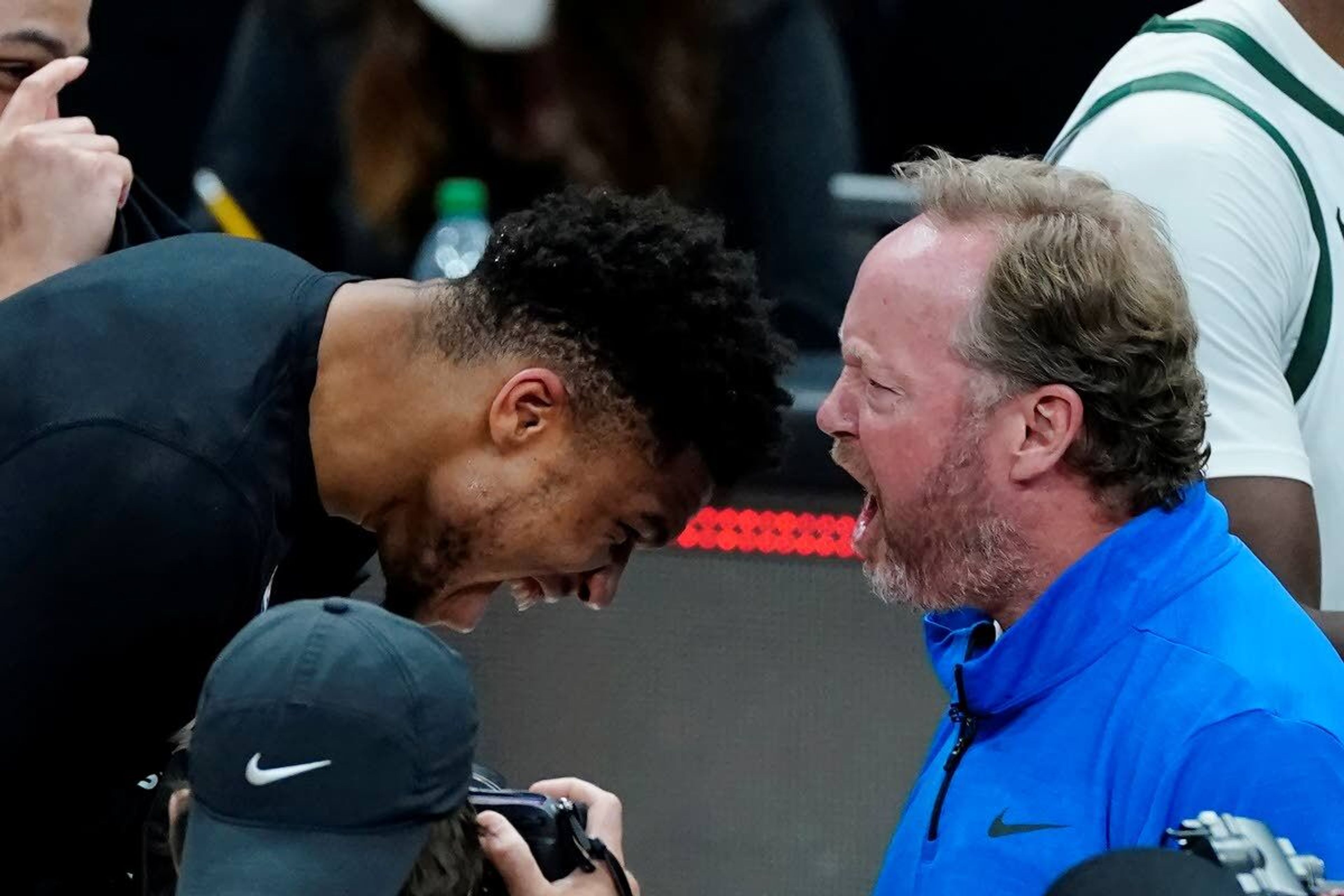 Milwaukee Bucks coach Mike Budenholzer and inured forward Giannis Antetokounmpo celebrate after the Bucks defeated the Atlanta Hawks in Game 6 of the Eastern Conference finals in the NBA basketball playoffs, advancing to the NBA Finals, Saturday, July 3, 2021, in Atlanta. (AP Photo/John Bazemore)