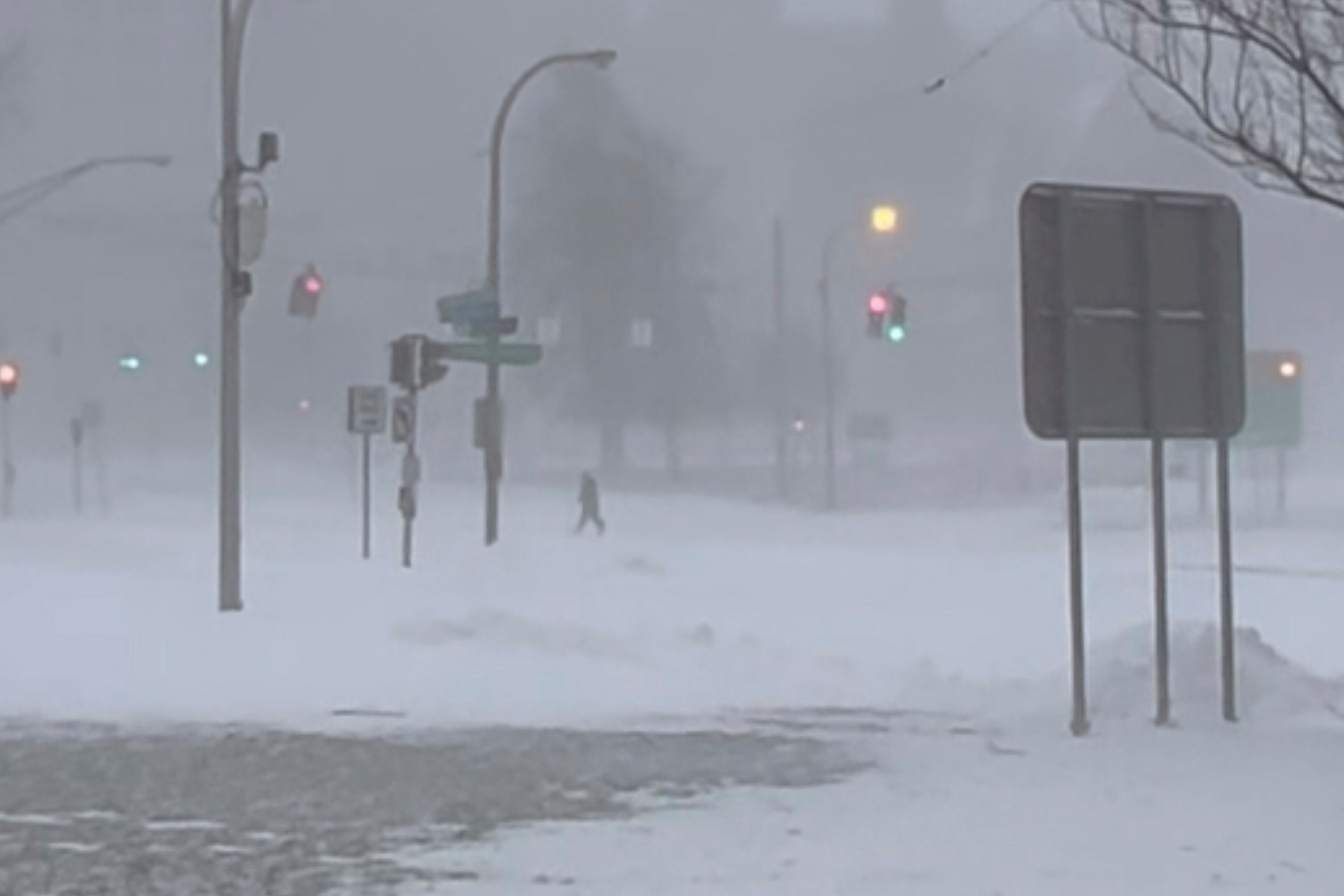 High winds and snow covers the streets and vehicles in Buffalo, N.Y. on Sunday, Dec. 25, 2022. Millions of people hunkered down in a deep freeze overnight and early morning to ride out the frigid storm that has killed at least 20 people across the United States, trapping some residents inside homes with heaping snow drifts and knocking out power to several hundred thousand homes and businesses.(WKBW via AP)