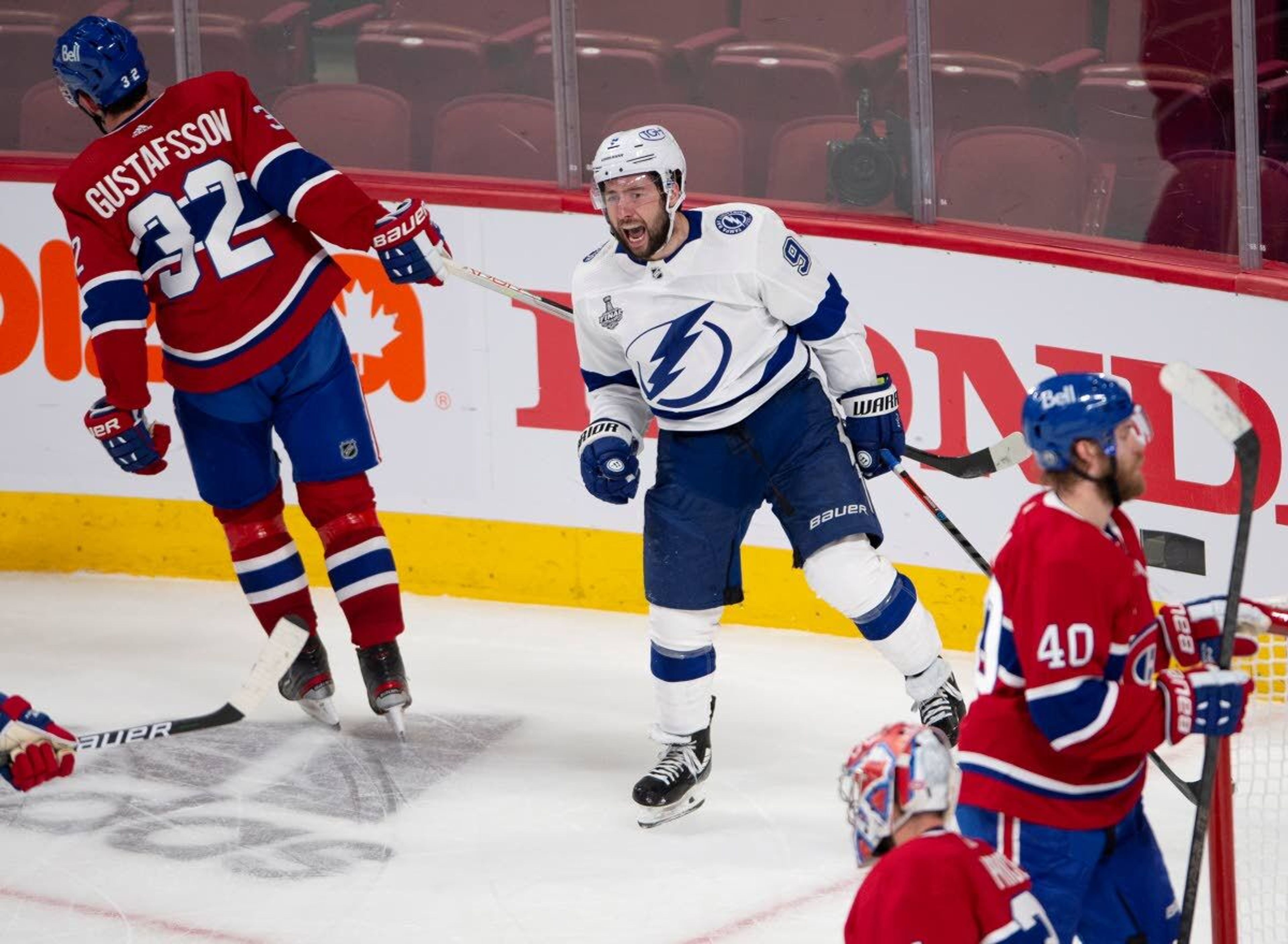 Tampa Bay Lightning center Tyler Johnson (9) celebrates after scoring against the Montreal Canadiens during the third period of Game 3 of the NHL hockey Stanley Cup Final, Friday, July 2, 2021, in Montreal. (Ryan Remiorz/The Canadian Press via AP)