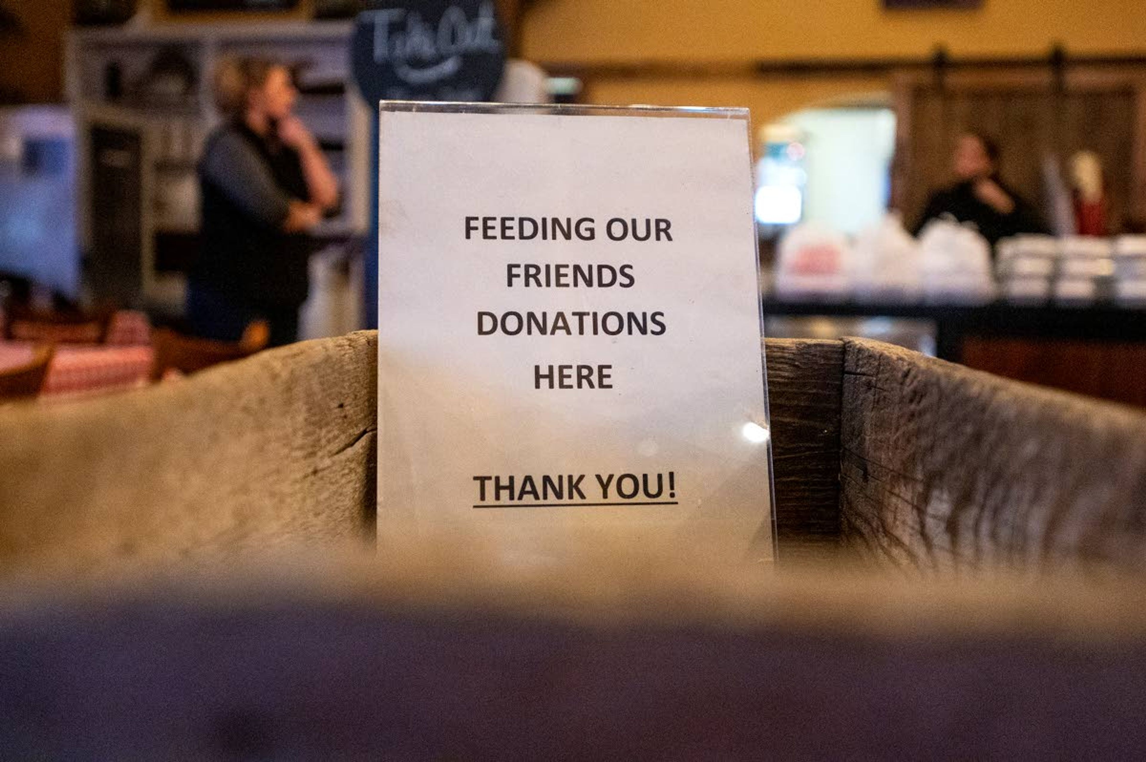 A donation box is placed in the front of Oak on Main for the Feeding Our Friends program Tuesday night in Pullman.