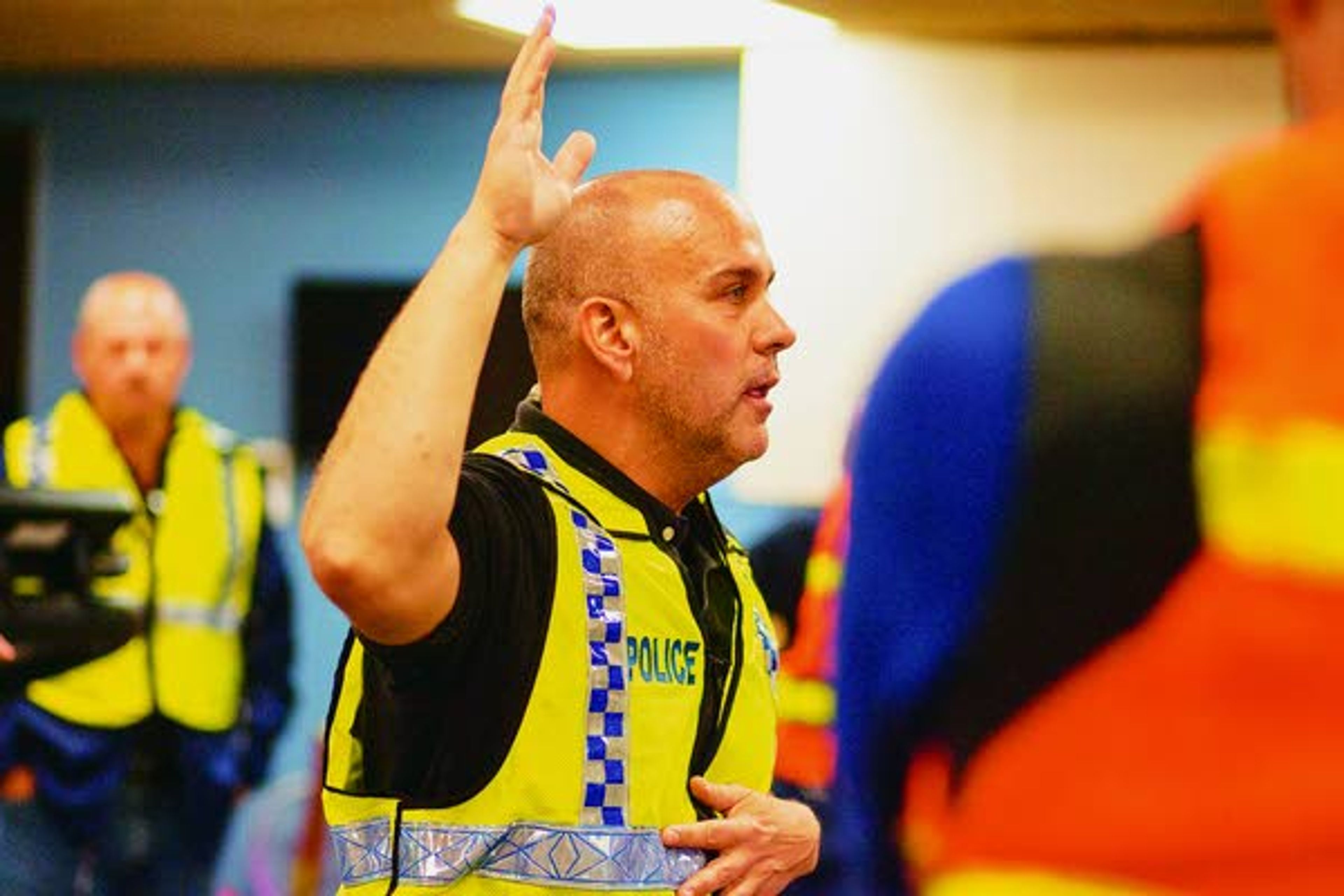 Pullman Police Department Detective Sgt. Dan Hargraves does a gives a final briefing and safety check for evaluators, observers and media members before an active shooter response drill Sunday at Summit Therapy in Pullman.