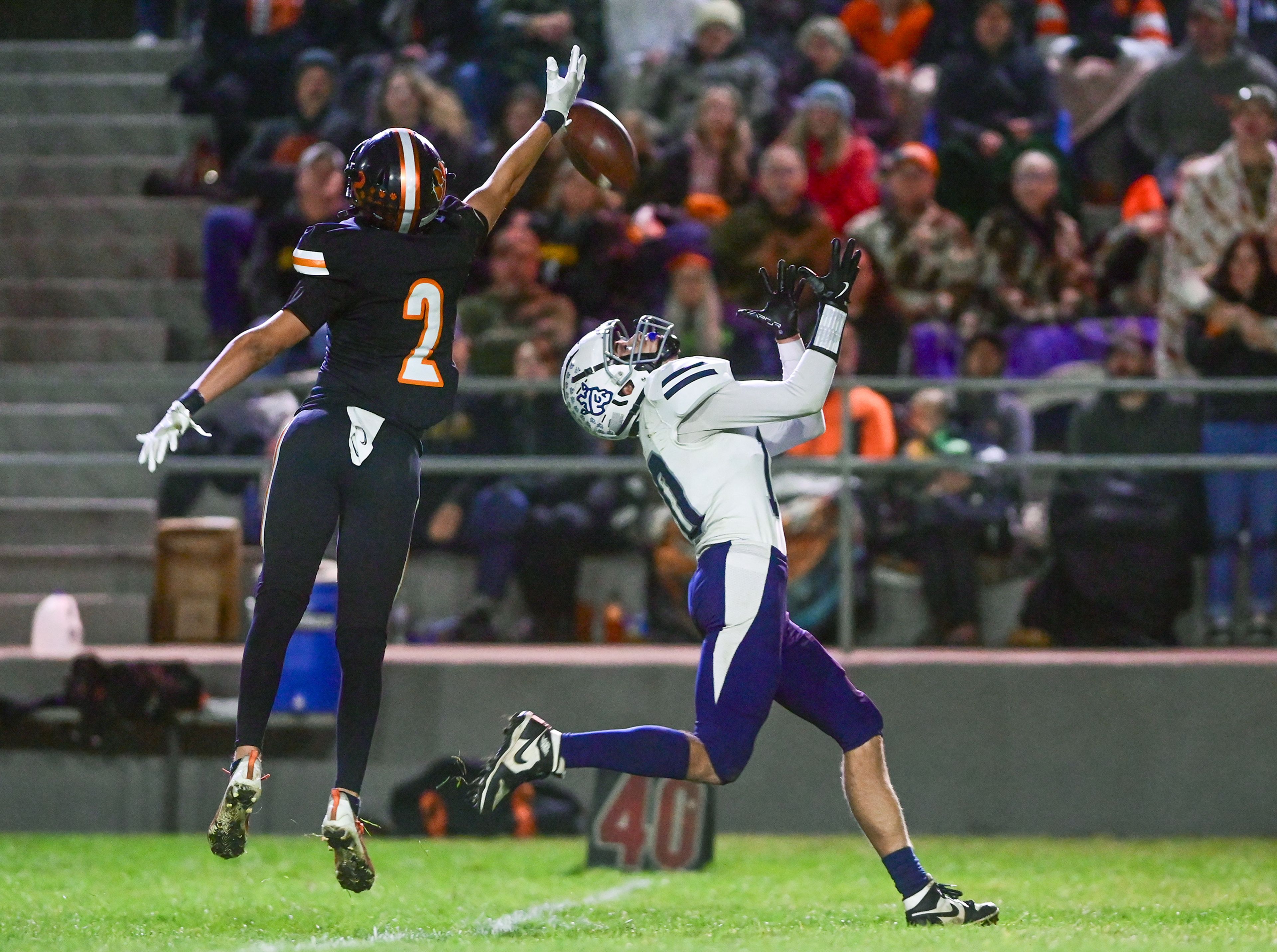 Kendrick�s Ralli Roetcisoender blocks a pass intended for Logos� Dominic Porras Friday in Kendrick.,