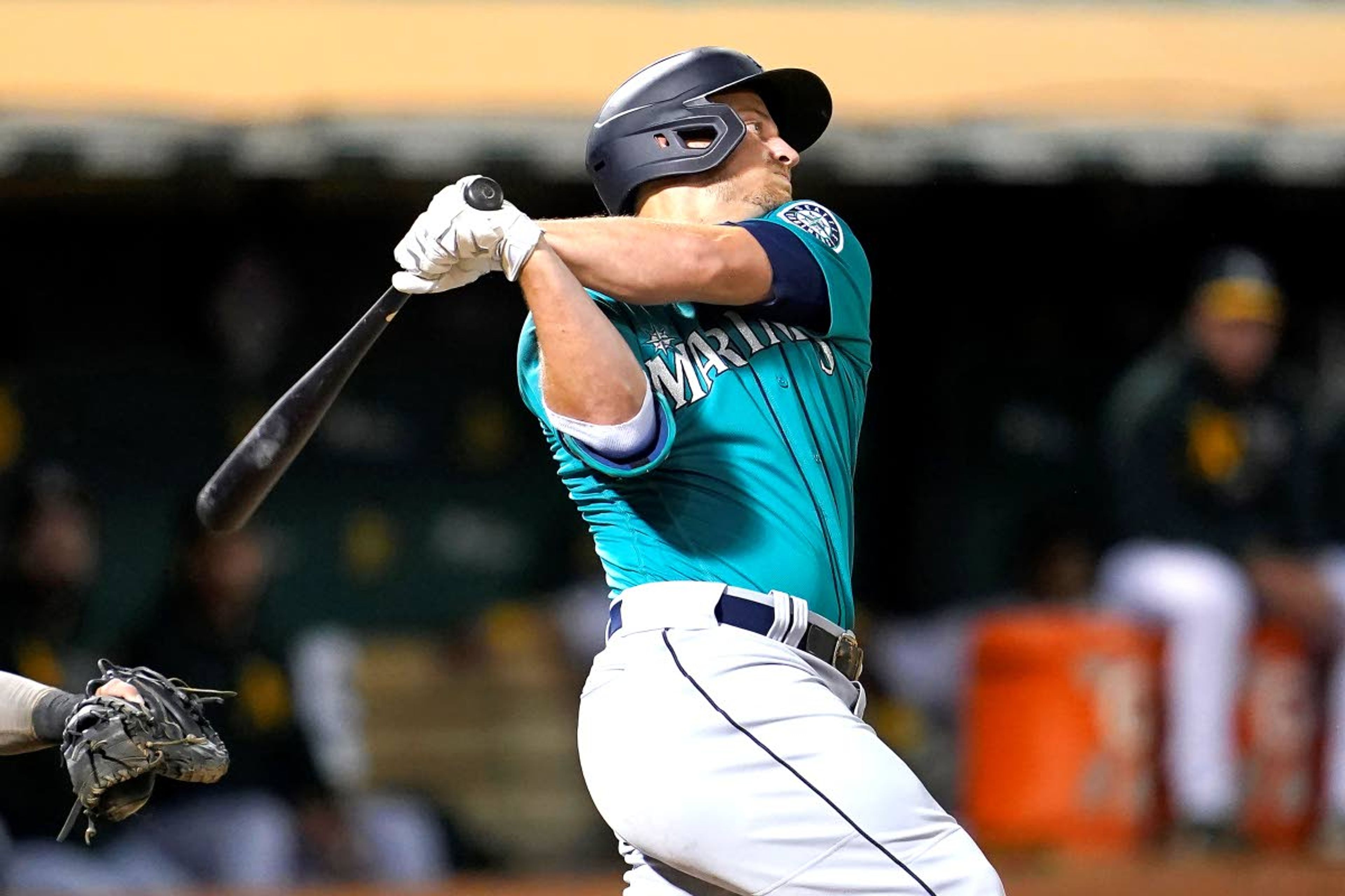 Seattle Mariners' Kyle Seager hits a two-run double against the Oakland Athletics during the third inning of a baseball game in Oakland, Calif., Monday, Sept. 20, 2021. (AP Photo/Jeff Chiu)