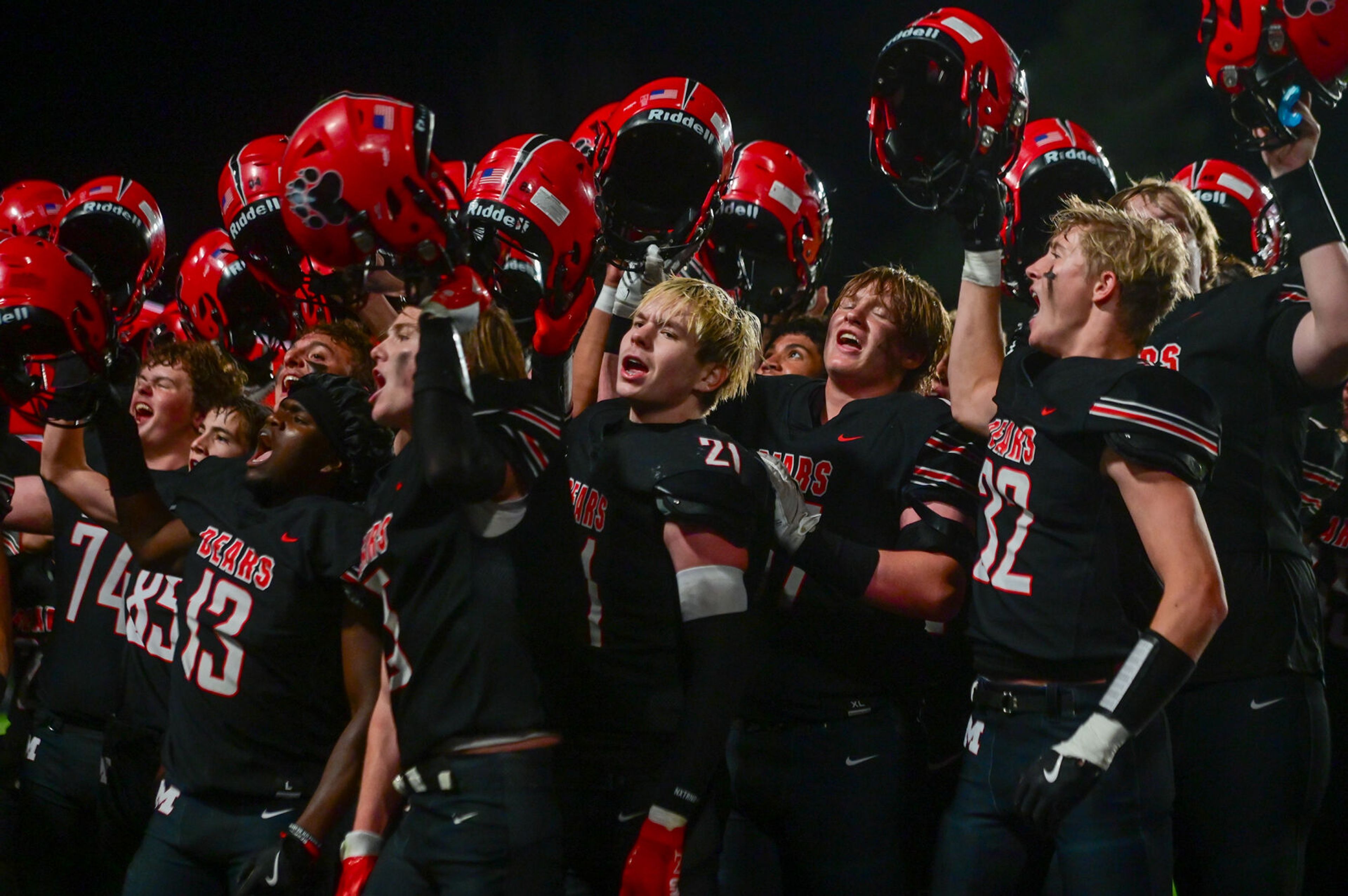 Moscow players sing along to the school’s fight song after a win over Pullman on Sept. 13 in Moscow.