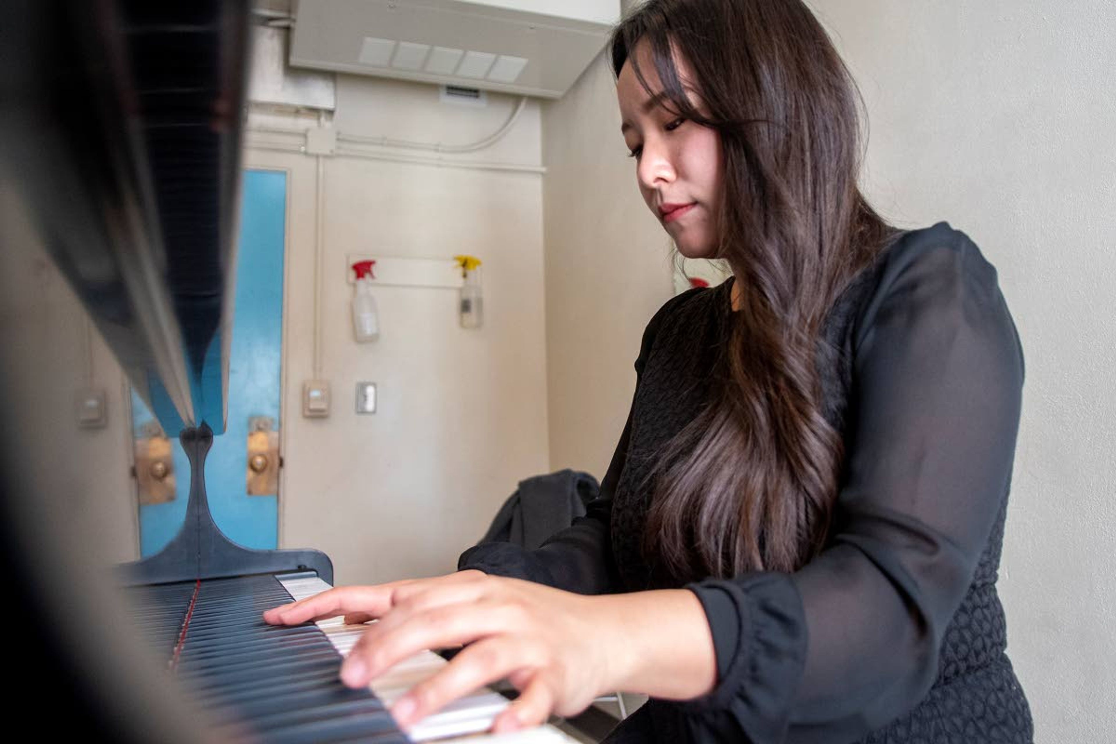 Zach Wilkinson/Daily NewsABOVE AND BELOW: Second-year masters student in the piano performance program at the University of Idaho, Eunbee Kim, practices in a studio Tuesday morning on the third floor of Ridenbaugh Hall.