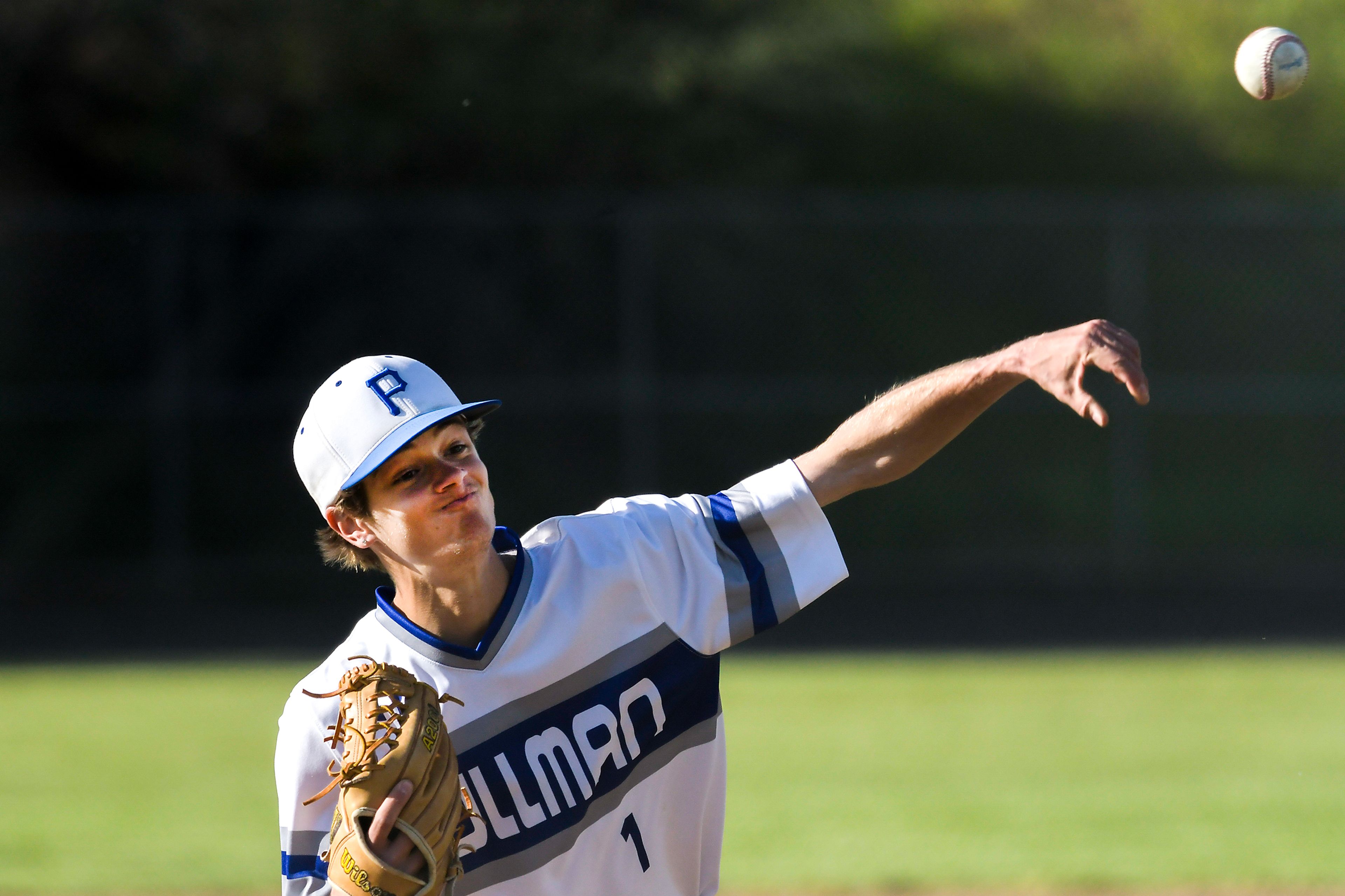 Pullman pitcher Calvin Heusser throws the final strike to end the game against Clarkston during a semifinal game of the district tournament Thursday in Pullman.