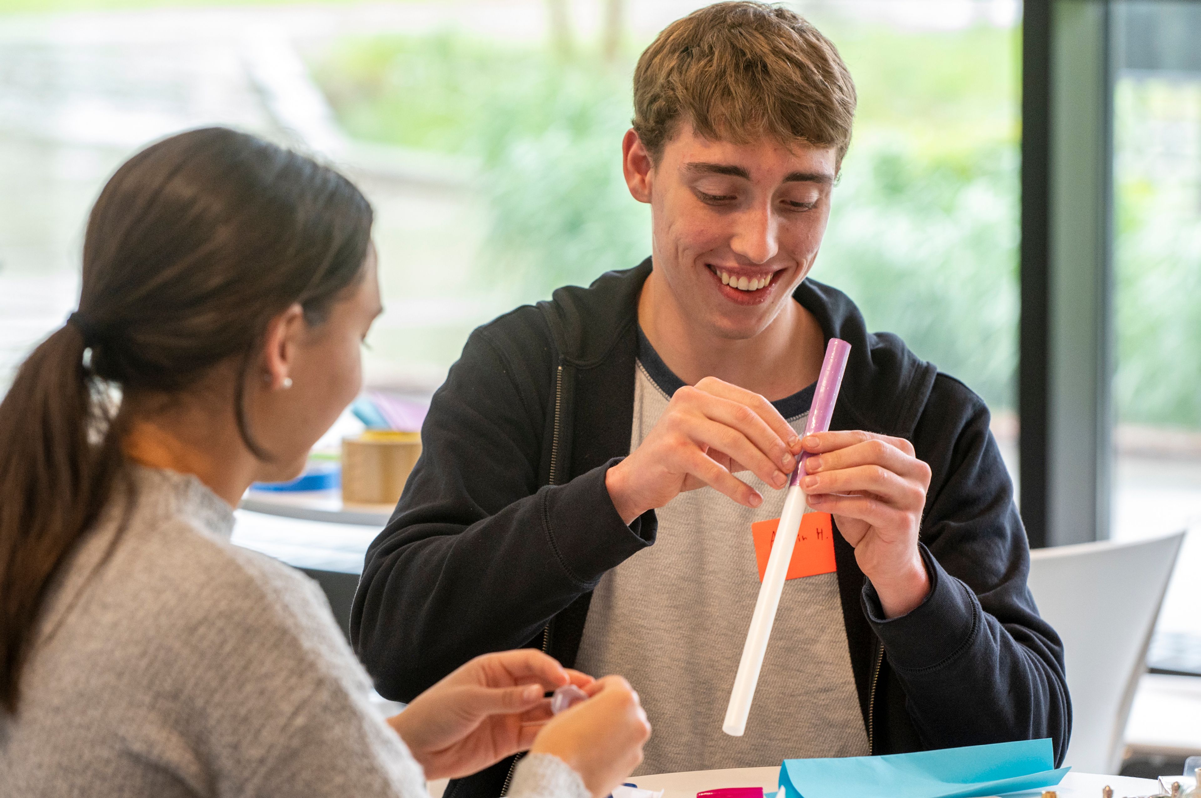 Sydney Arellano, of Lewiston, left, and Aydin Hasz, of Wallace, Idaho, create an air-powered rocket during the Idaho Science and Aerospace Scholars capstone event Monday inside the atrium of the Integrated Research and Innovation Center on University of Idaho’s campus in Moscow.