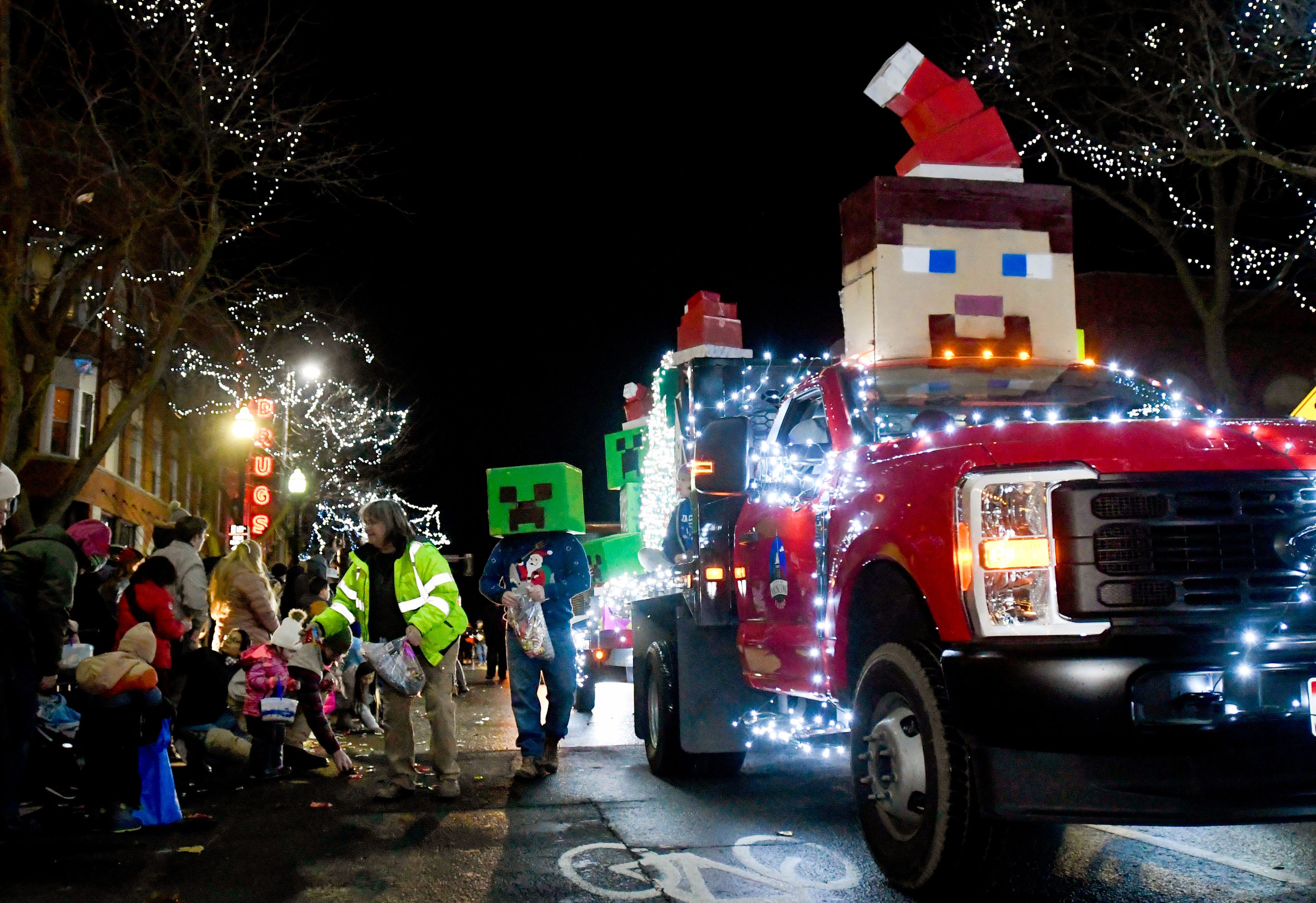 A city of Moscow truck sports a Minecraft-themed float while candy is handed out to the crowd watching the Light Up the Season parade along Main Street in Moscow on Thursday.