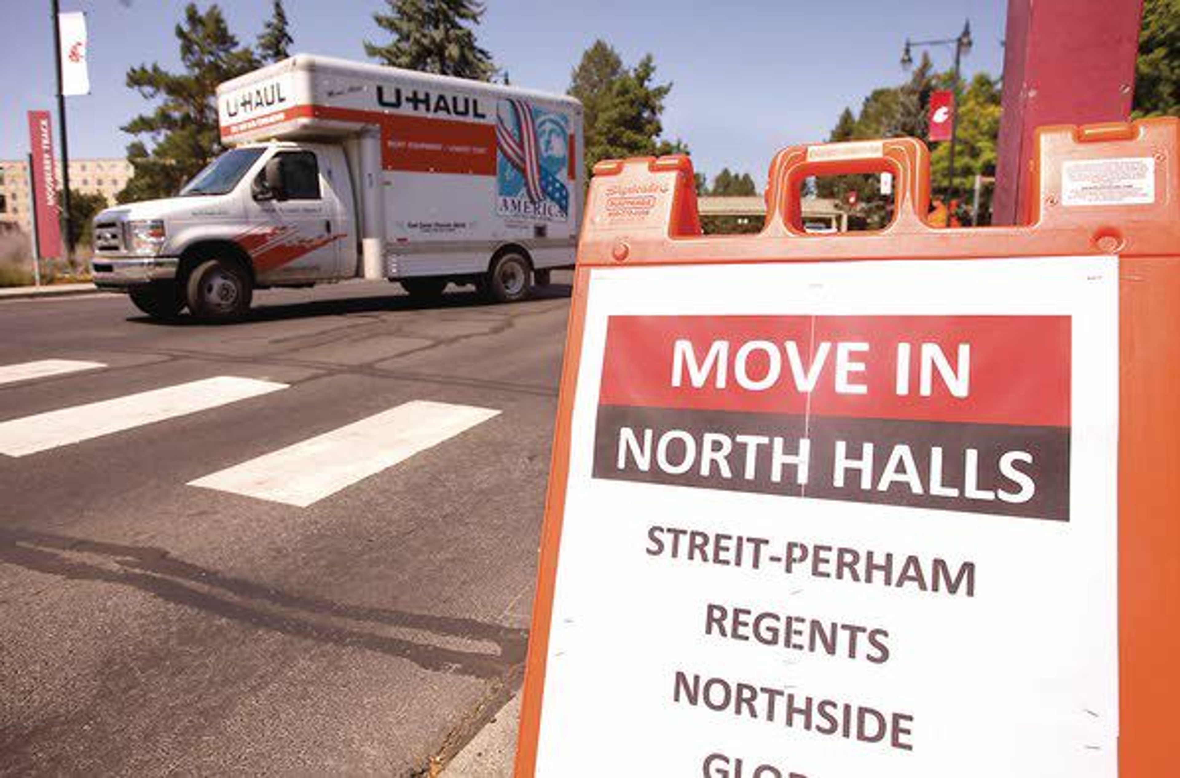 A U-Haul truck turns onto Stadium Way during the first day for students to move into residence halls at Washington State University on Wednesday in Pullman.