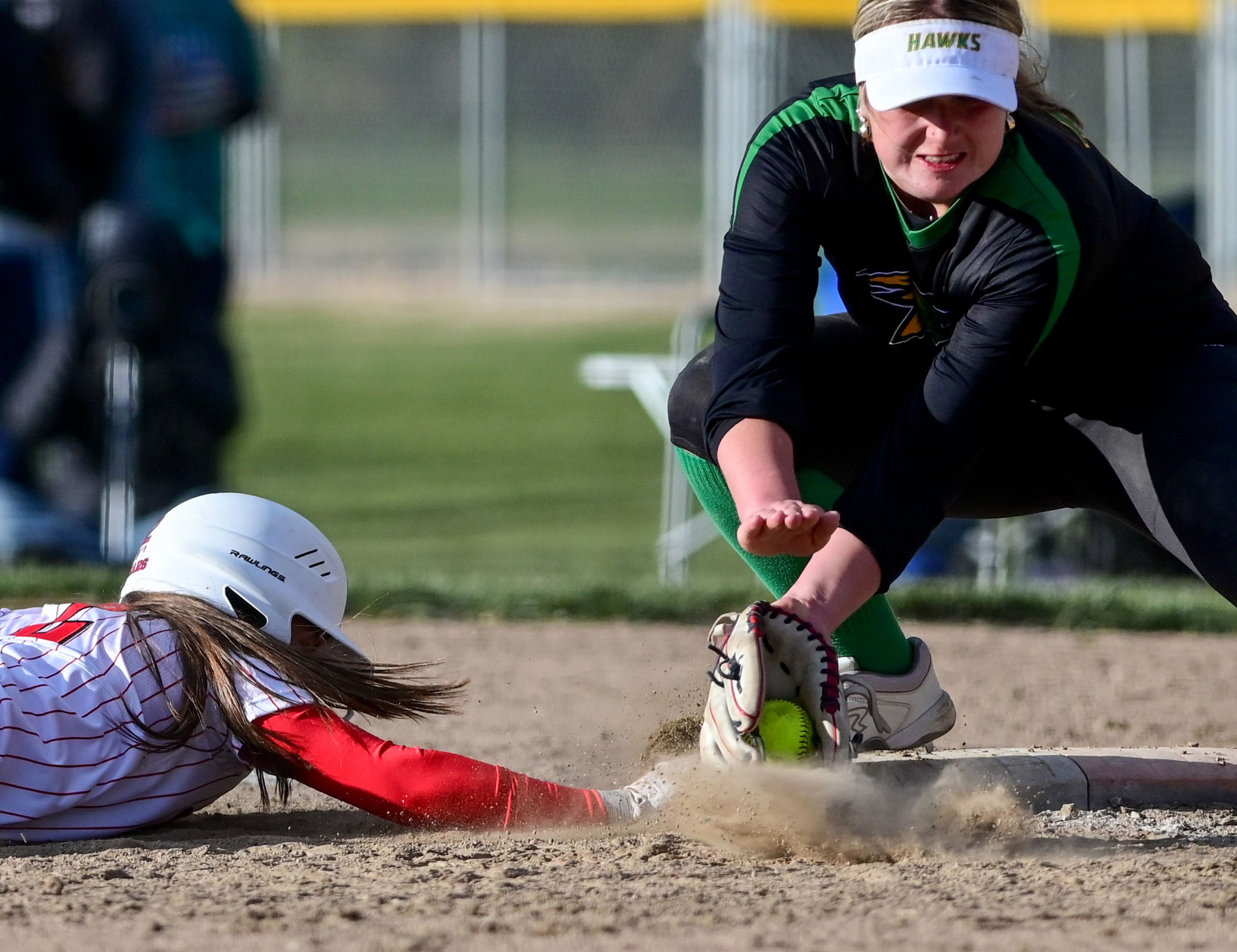 Moscow’s Sadie Newlan (2), left, slides to tag up just before a catch by Lakeland’s first baseman in Moscow on Tuesday.