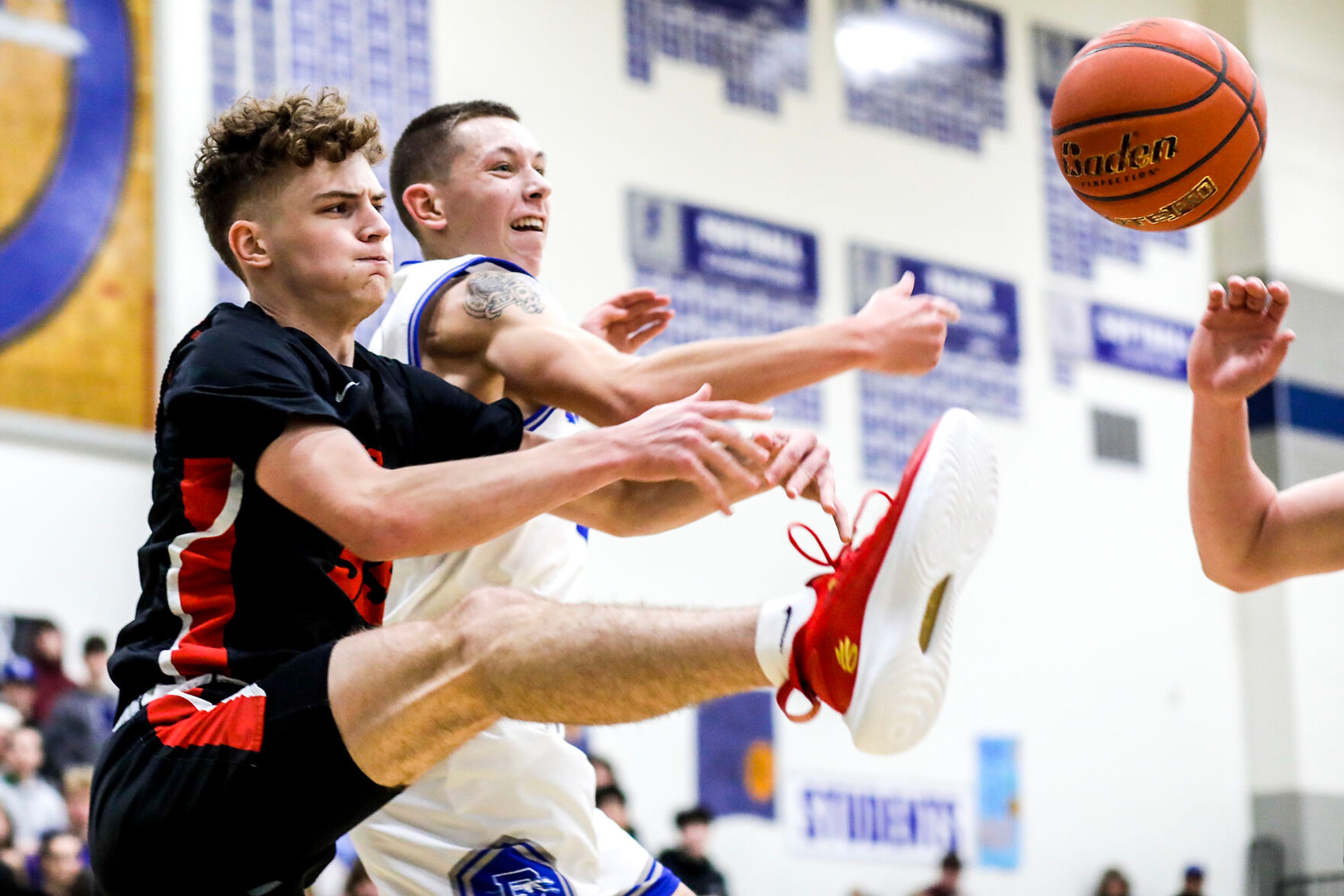 Moscow guard Ian Hillman, left, and Pullman small forward Dane Sykes battle for a rebound during Saturday's nonleague boys basketball game.