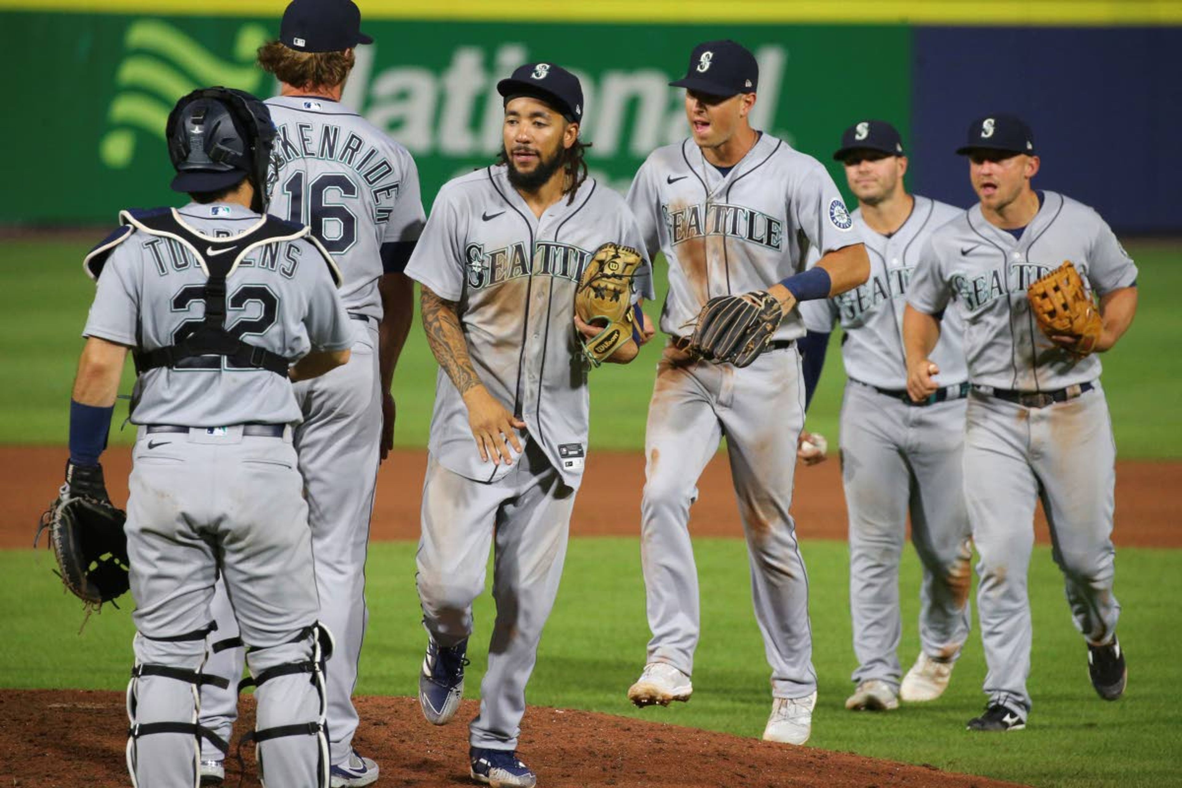 Associated PressMariner players celebrate a 9-7 victory over the Blue Jays following the 10th inning of a game Wednesday in Buffalo, N.Y.