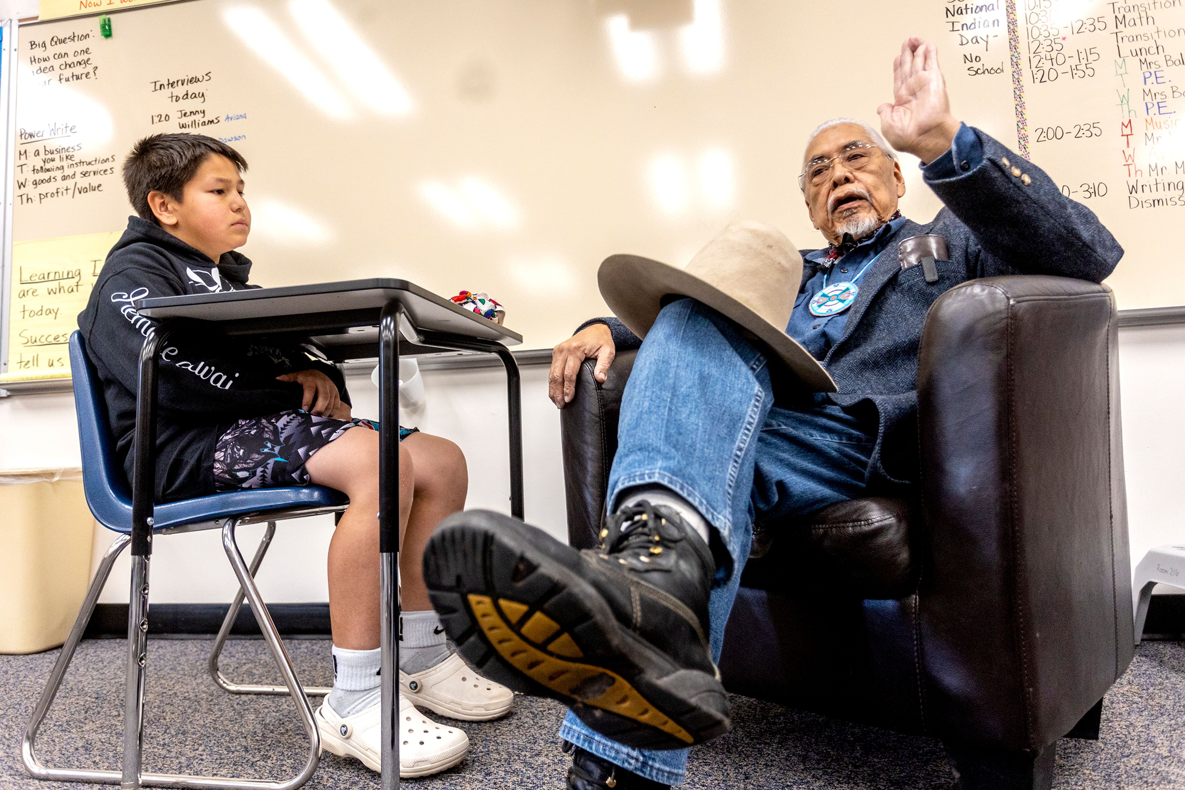 Dawson Whitman interviews his grandfather Silas Whitman in his fifth grade class at Lapwai Elementary School on May 10, 2022. The elder Whitman, who died Oct. 1, was instrumental in building the Nez Perce Tribe's successful fisheries program.