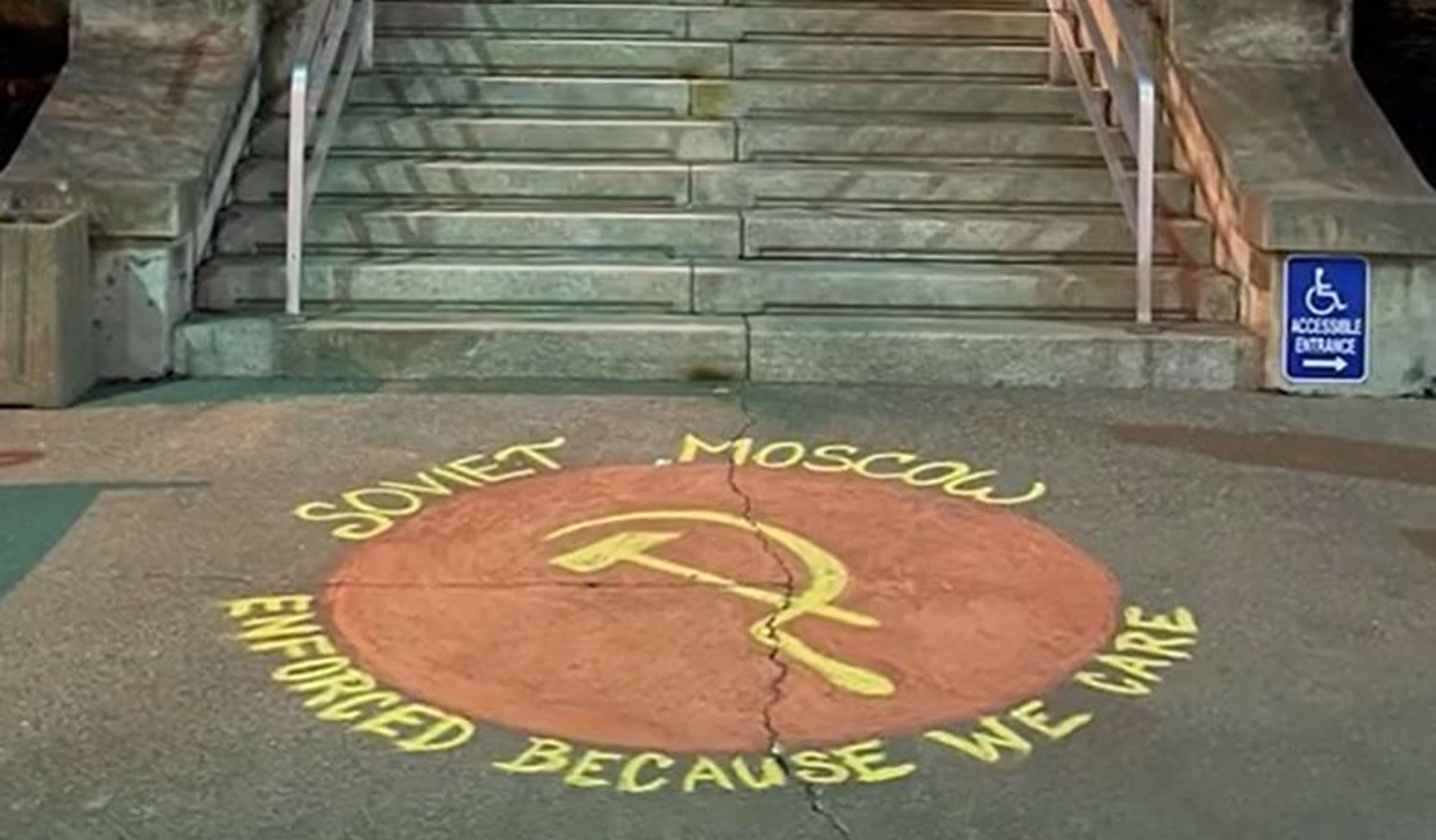 In a video screen grab, chalk art is shown Thursday night near the steps of Moscow City Hall. The chalk art image is similar to that shown on stickers posted downtown in October, which led to charges against those posting the stickers.