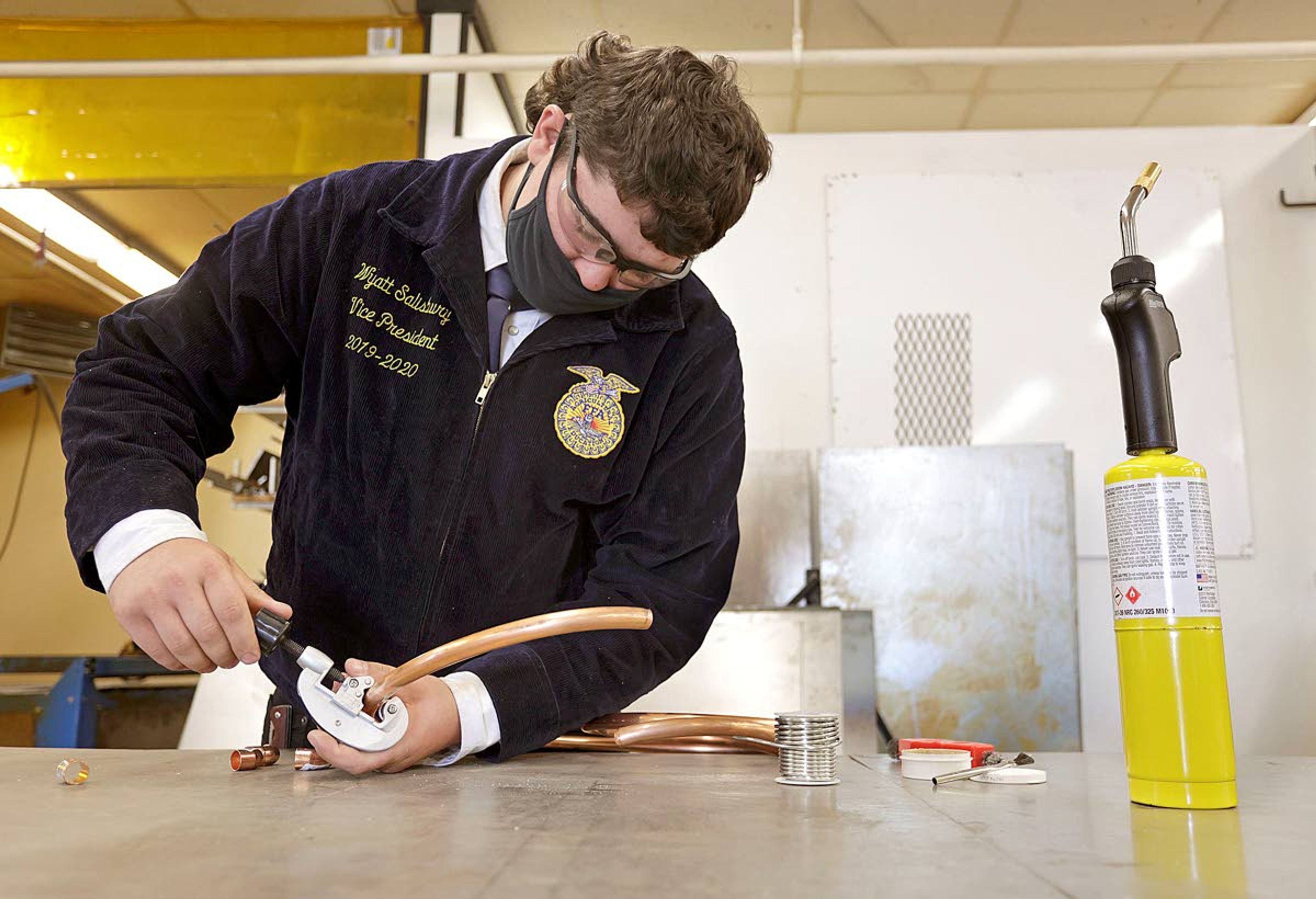 Geoff Crimmins/Daily NewsJunior Wyatt Salisbury demonstrates a pipe-fitting project Tuesday at Moscow High School. Salisbury is part of the school’s FFA chapter, which was started in 2019.