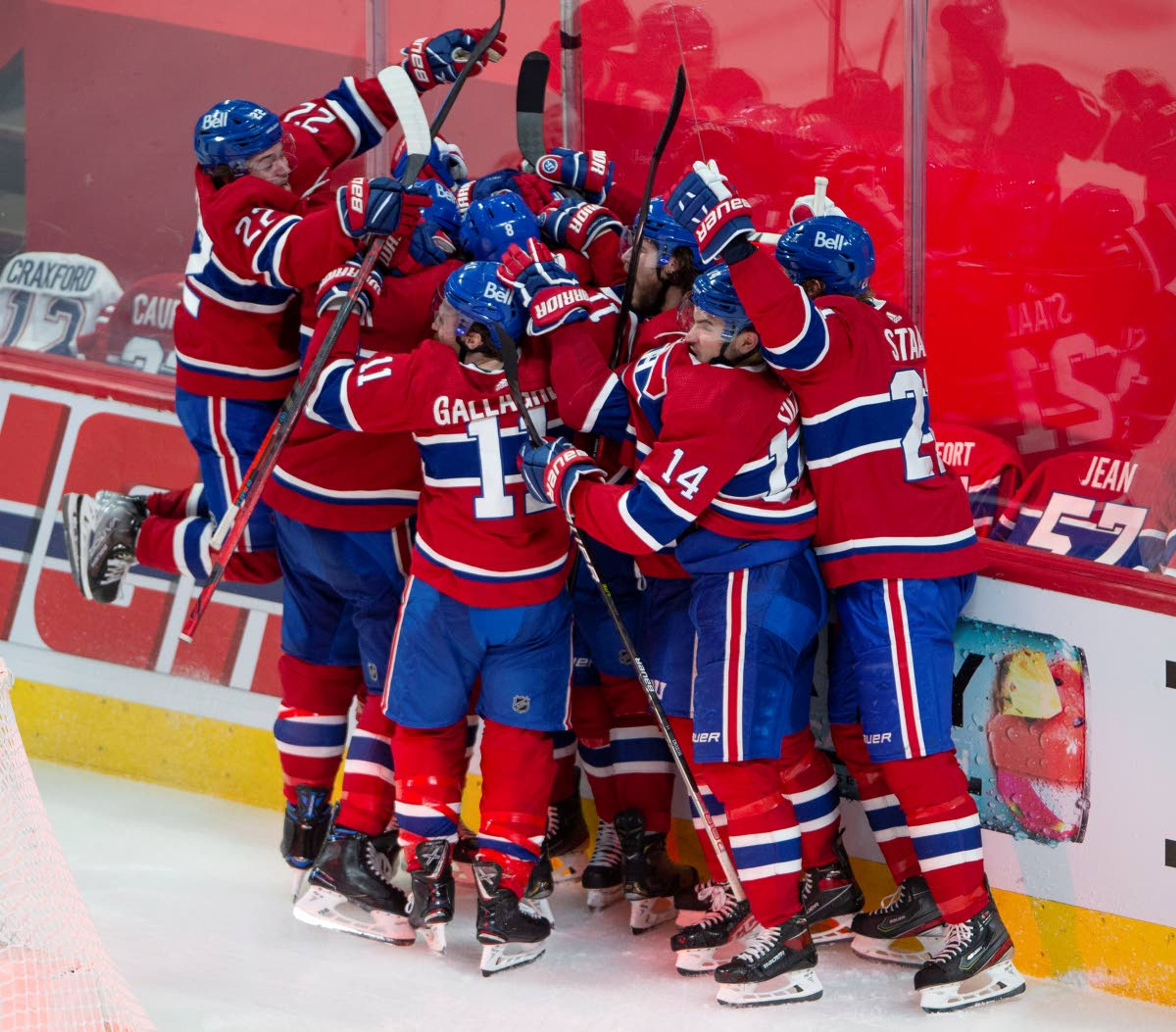 Montreal Canadiens players celebrate after defeating the Vegas Golden Knights following overtime in Game 6 of an NHL hockey Stanley Cup semifinal playoff series Thursday, June 24, 2021 in Montreal. (Ryan Remiorz/The Canadian Press via AP)