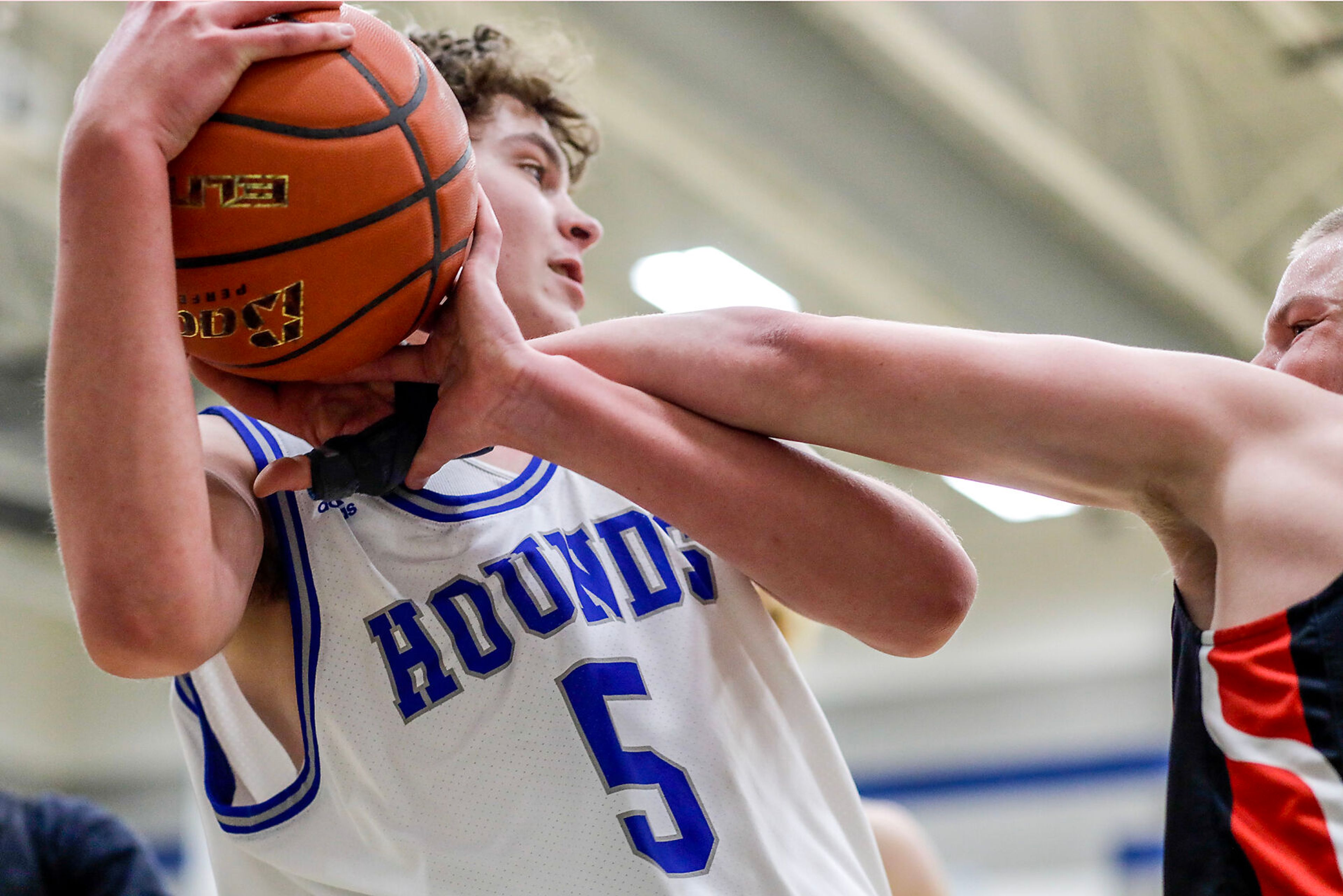 Moscow guard Cody Wilson, right, tries to steal the ball away from Pullman small forward Alex Bicklehaupt during Saturday's nonleague boys basketball game.