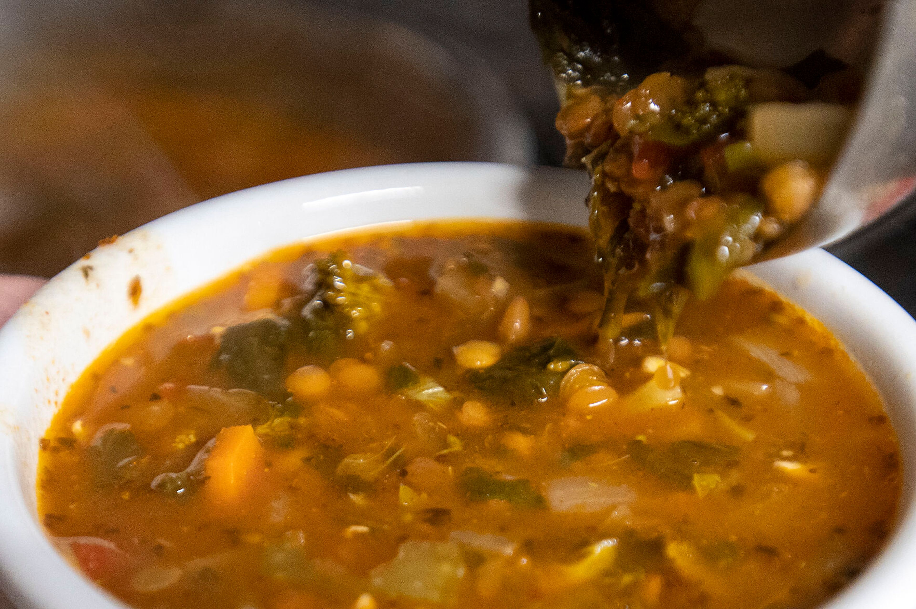 Mina Ashkannejhad pours a bowl of lentil soup at Mikey’s Gyros in Moscow.