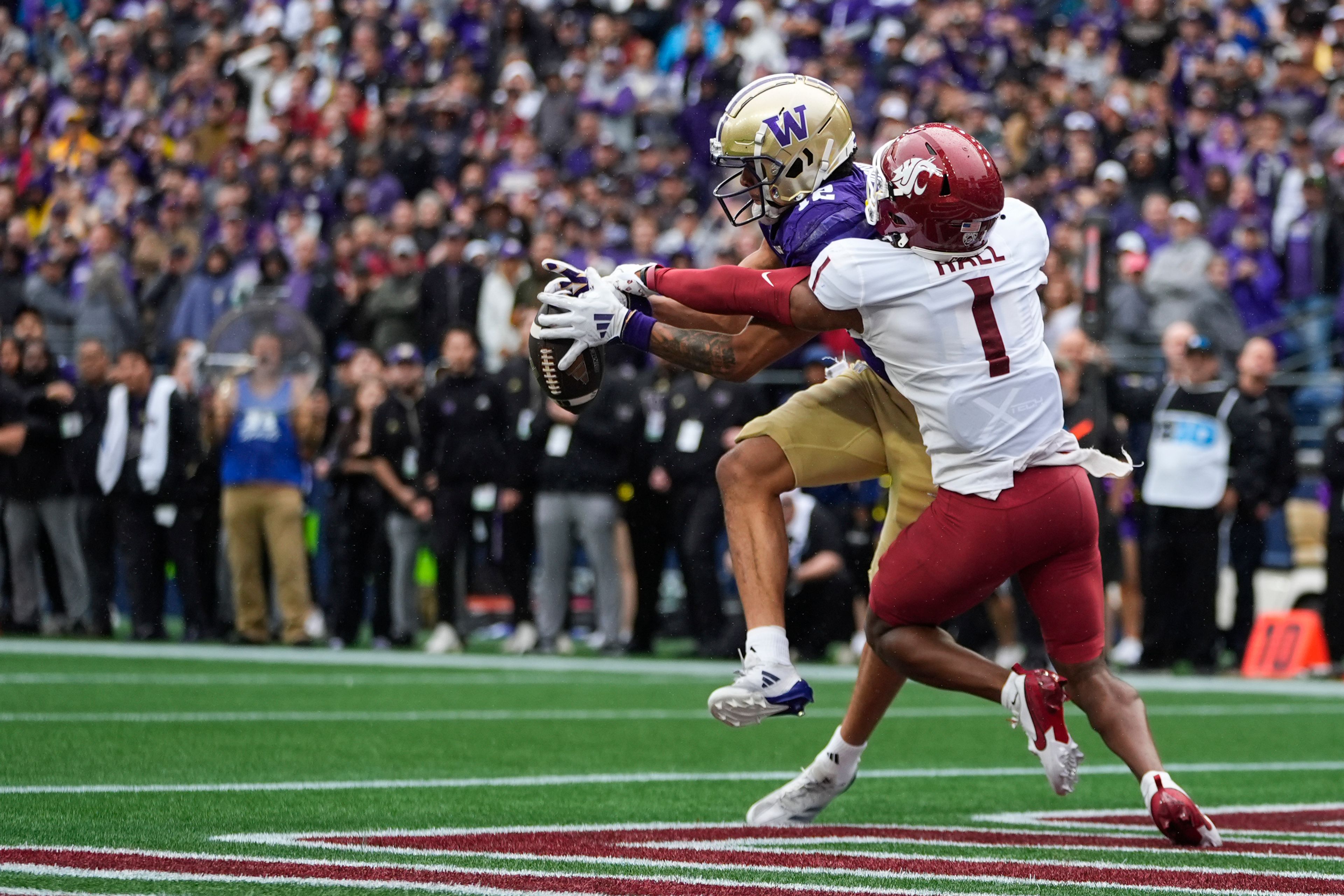 Washington State defensive back Stephen Hall (1) forces an incomplete pass in the end zone against Washington wide receiver Denzel Boston (12) during the second half of an NCAA college football game Saturday, Sept. 14, 2024, in Seattle. Washington State won 24-19. (AP Photo/Lindsey Wasson)