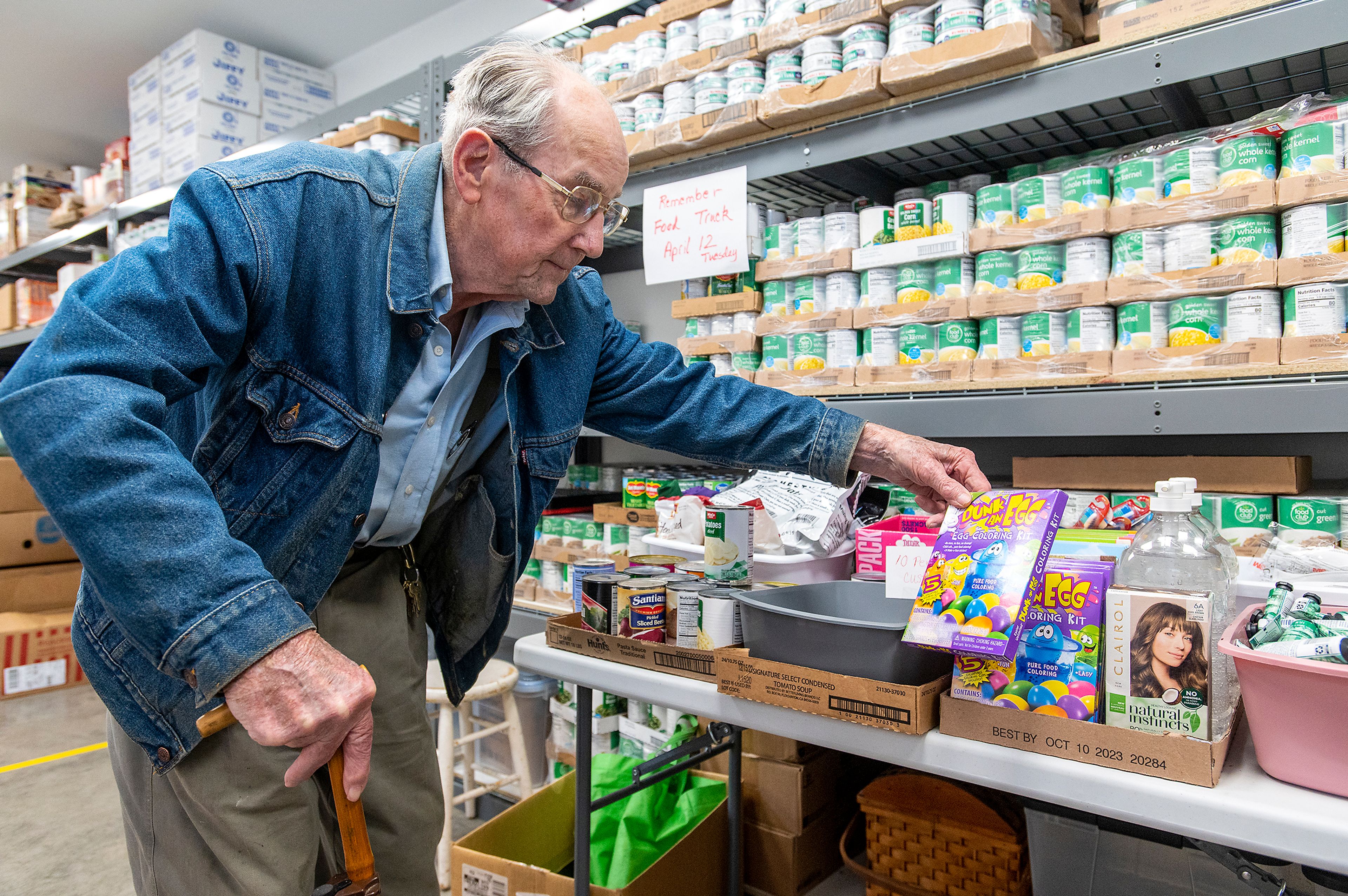 Zach Wilkinson/Daily News A shopper, who asked to be identified as Allen, browses through items at the Moscow Food Bank as director Linda Nickels, not pictured, prepares his grocery list Thursday afternoon in Moscow. When asked about his thoughts on the resources being provided at the Moscow Food Bank, Allen responded, “It really is wonderful.”