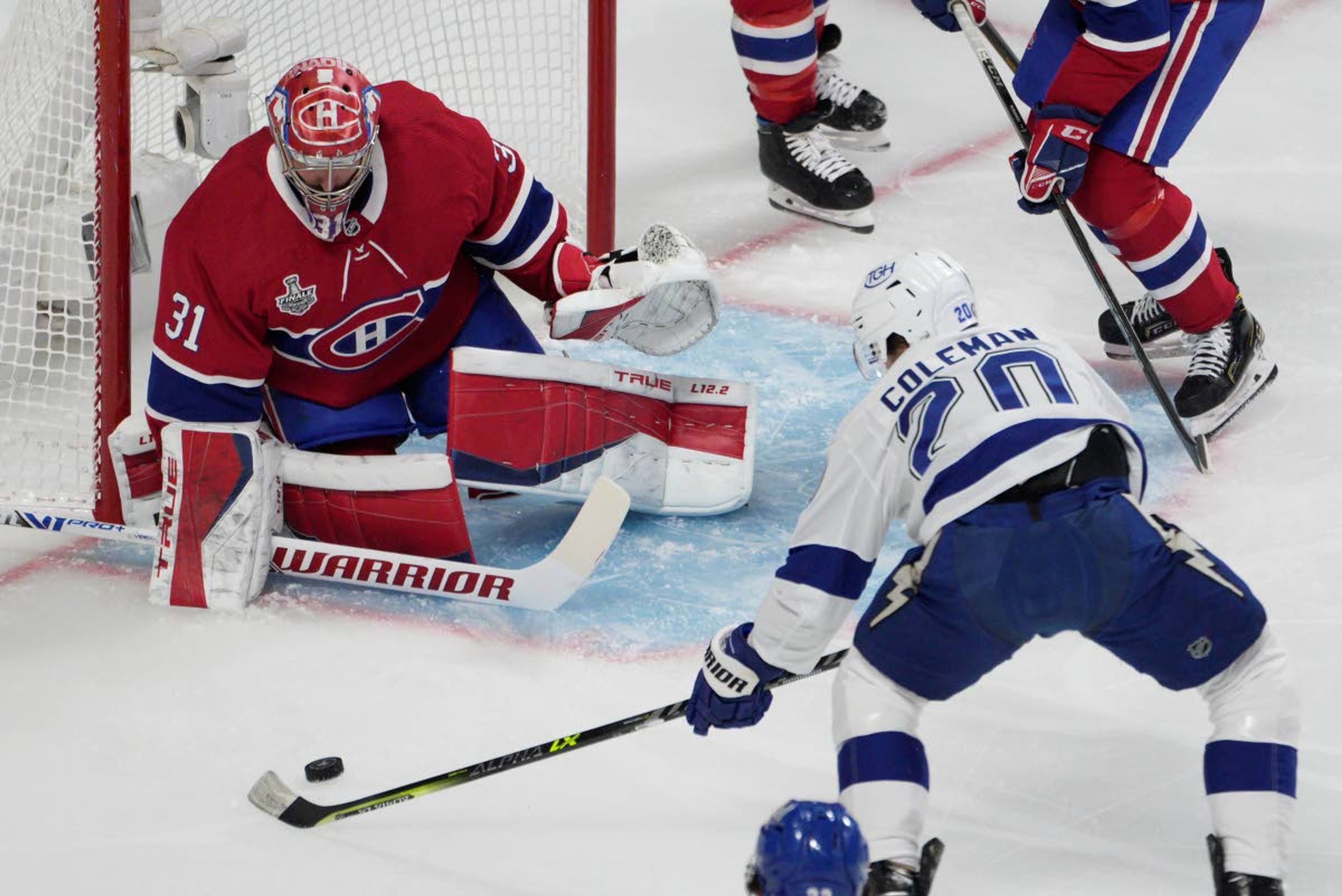 Montreal Canadiens goaltender Carey Price (31) makes a save against Tampa Bay Lightning center Blake Coleman (20) during the first period of Game 4 of the NHL hockey Stanley Cup final in Montreal, Monday, July 5, 2021. (Paul Chiasson/The Canadian Press via AP)