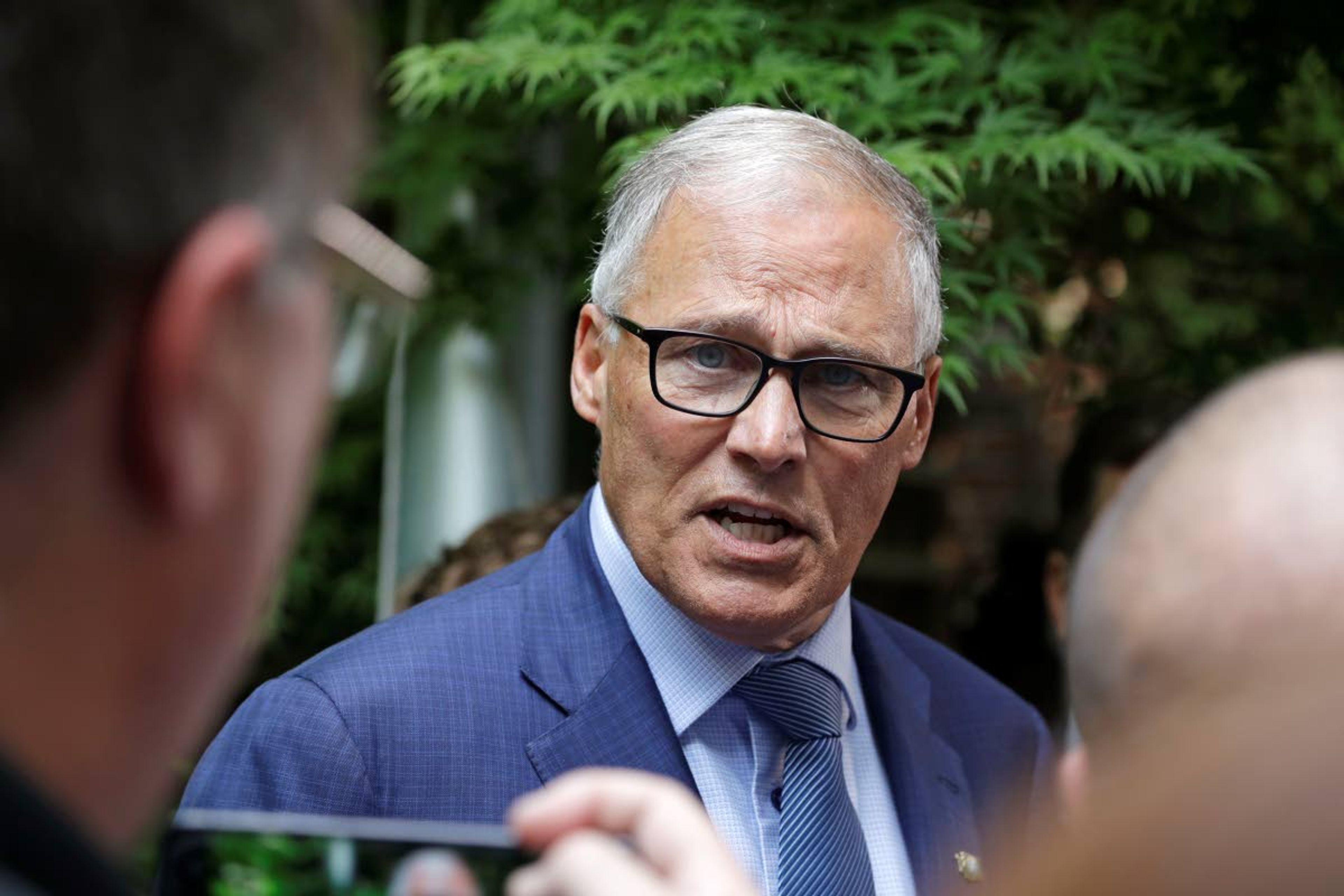 Washington Gov. Jay Inslee speaks with reporters Aug. 22 in Seattle.